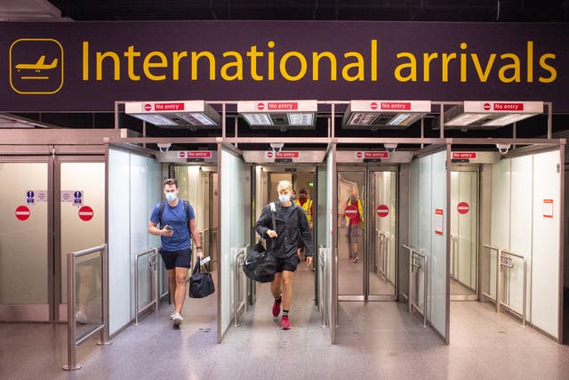 Passengers arrive at Gatwick Airport (PA)