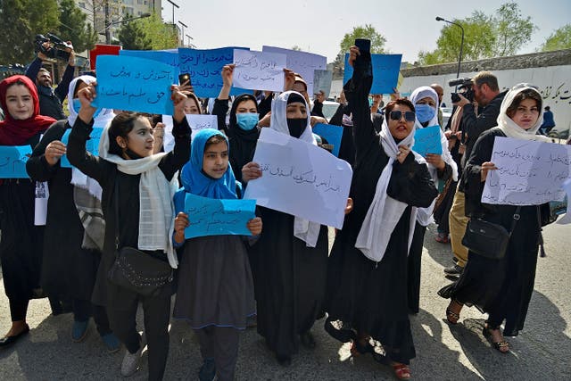 <p>Afghan women and girls take part in a protest in front of the Ministry of Education in Kabul </p>