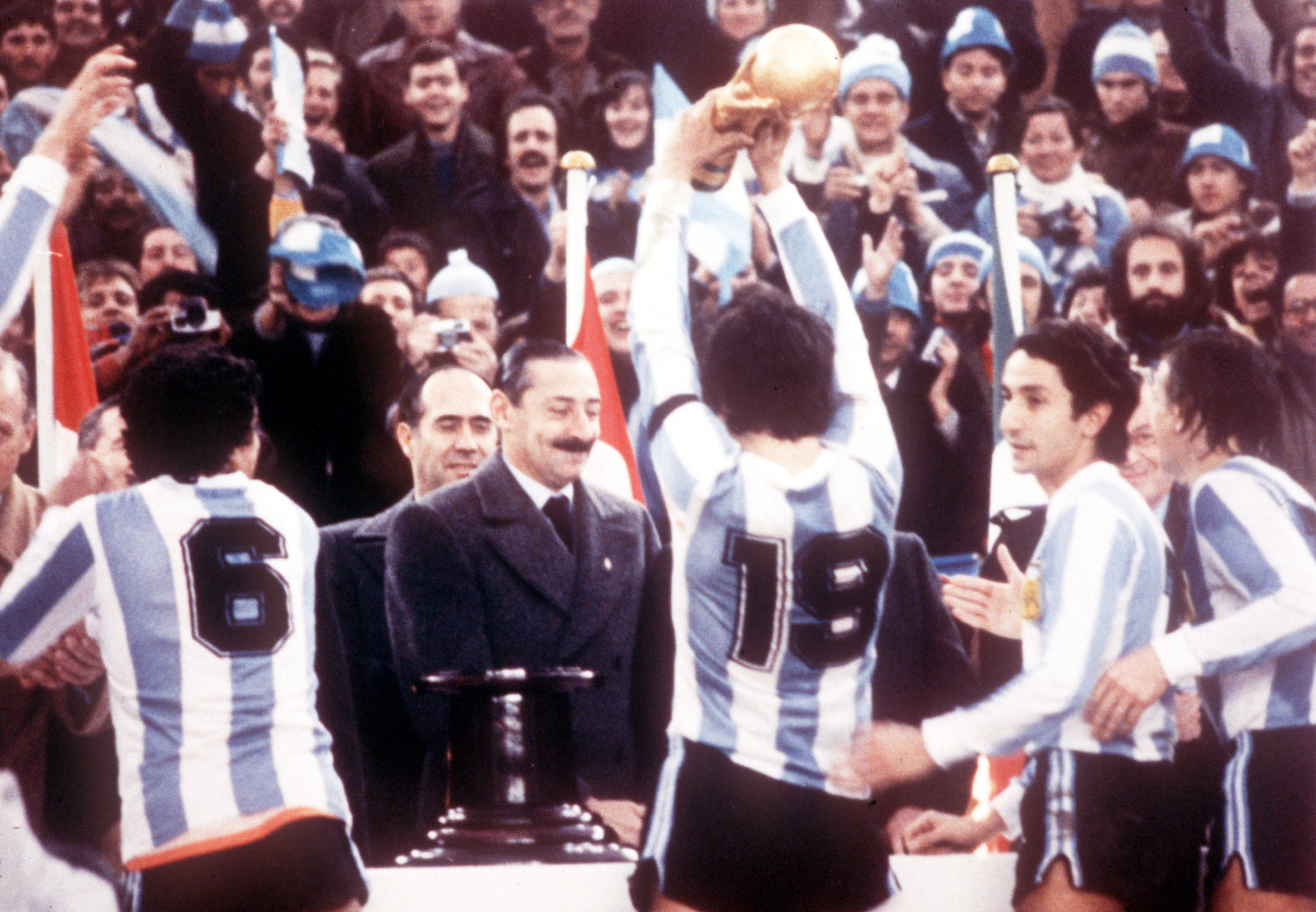 Argentine dictator Jorge Rafael Videla presents the World Cup to Argentina captain Daniel Passarella on 25 June 1978. Other players pictured include former Spurs player Osvaldo Ardiles (second right). Argentina beat Holland 3-1 in the final