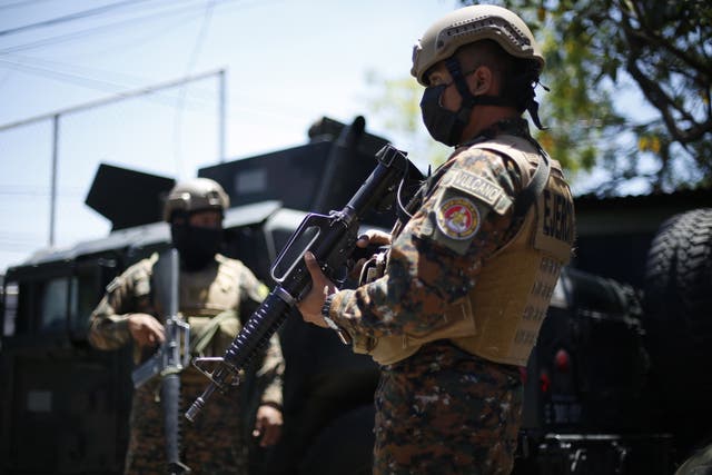 <p>Army members carry on searches at a check point in Santa Tecla, El Salvador</p>