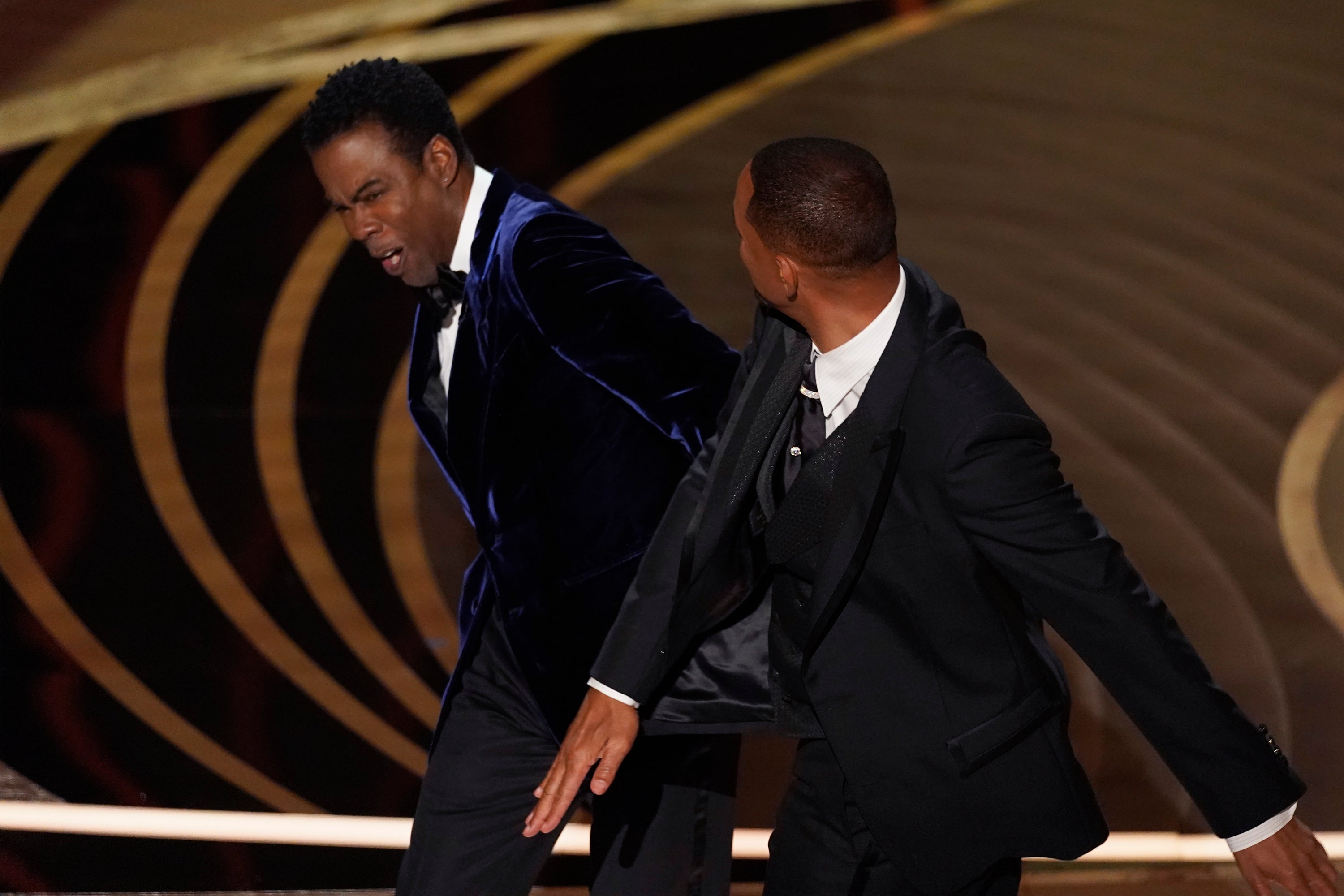 Will Smith hitting Chris Rock onstage at the 2022 Oscars (Chris Pizzello/AP)