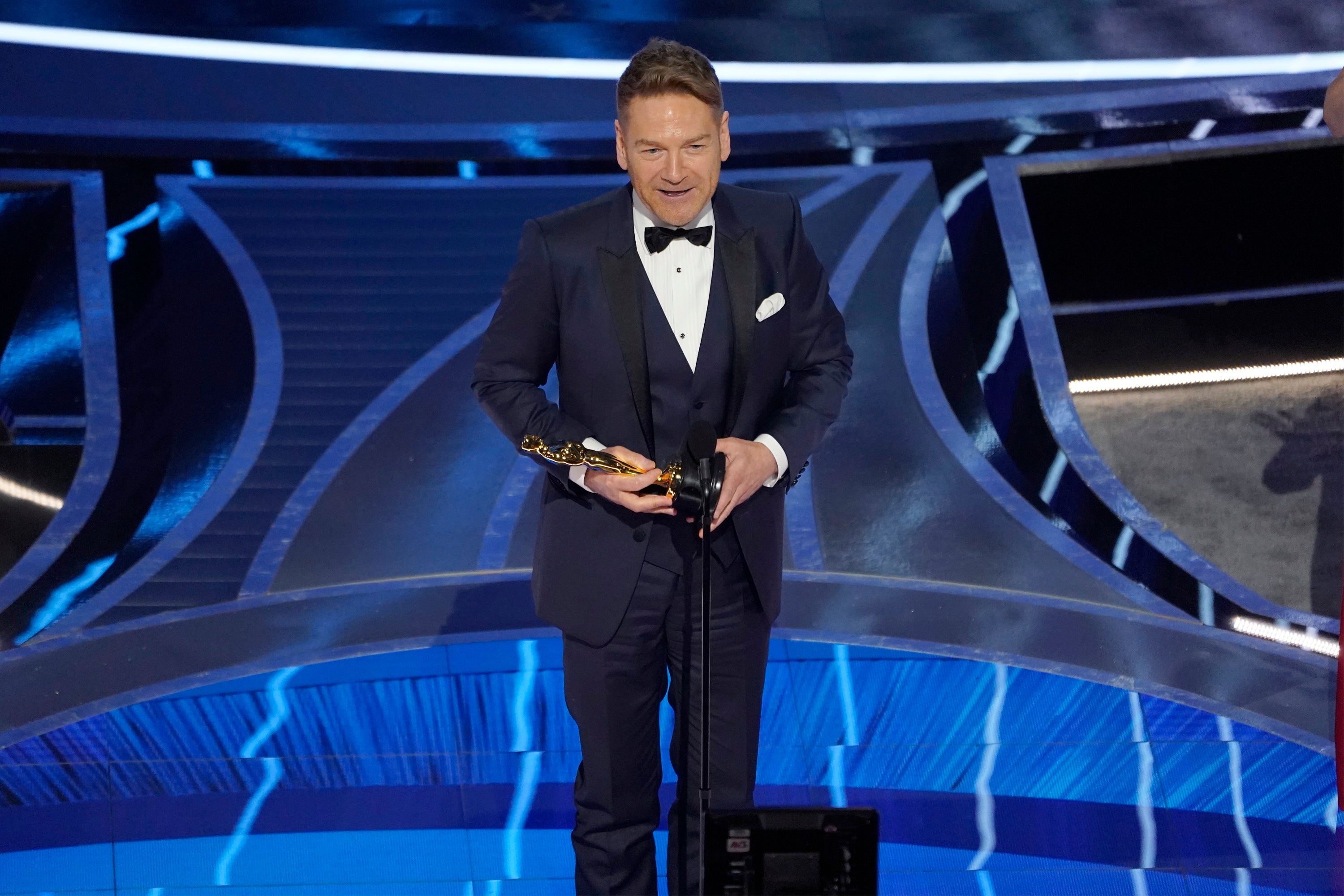 Kenneth Branagh accepts the award for best original screenplay for Belfast at the 2022 Oscars (Chris Pizzello/AP)