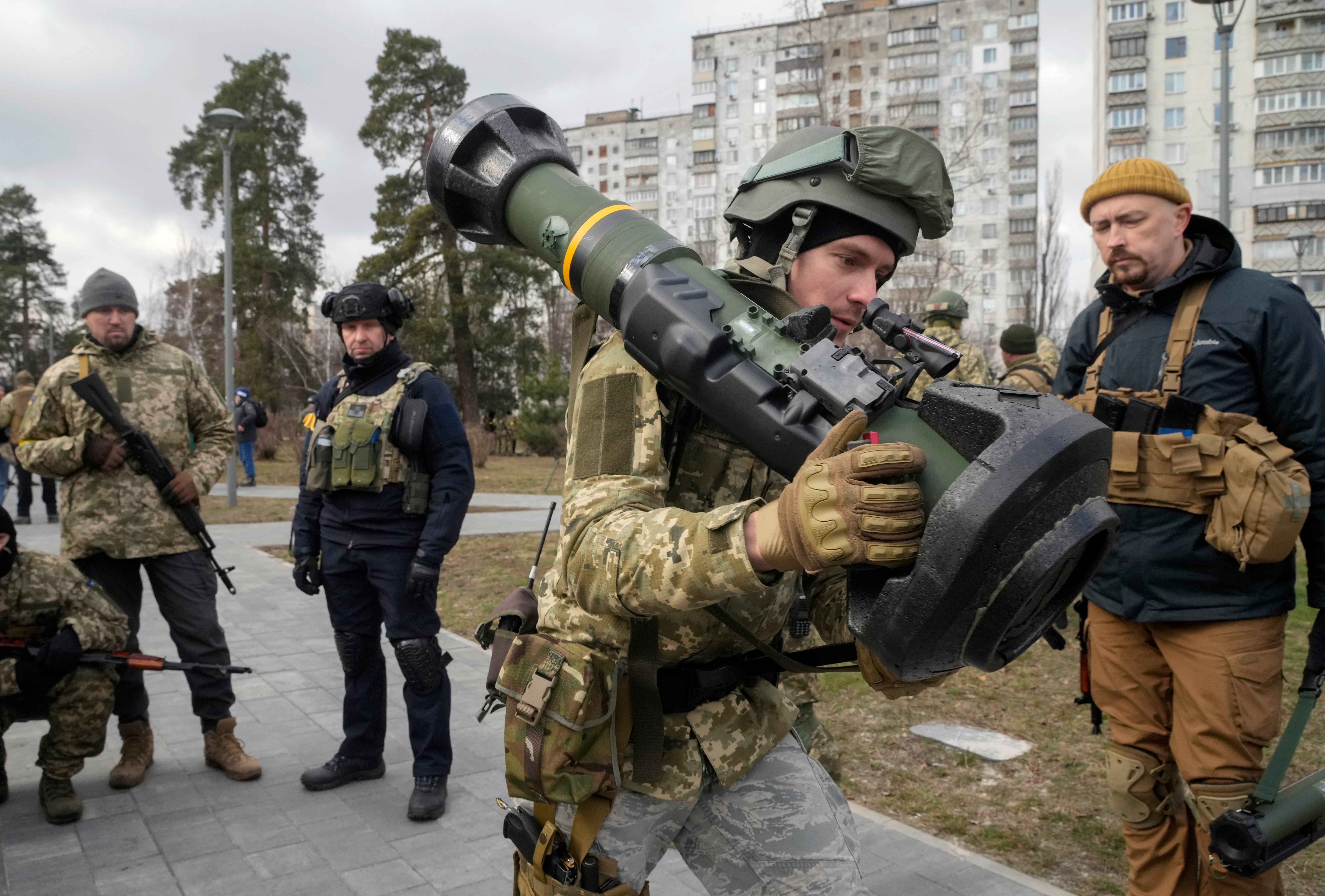 A Ukrainian Territorial Defence Forces member holds an NLAW anti-tank weapon in the outskirts of Kyiv during the early days of the conflict in March