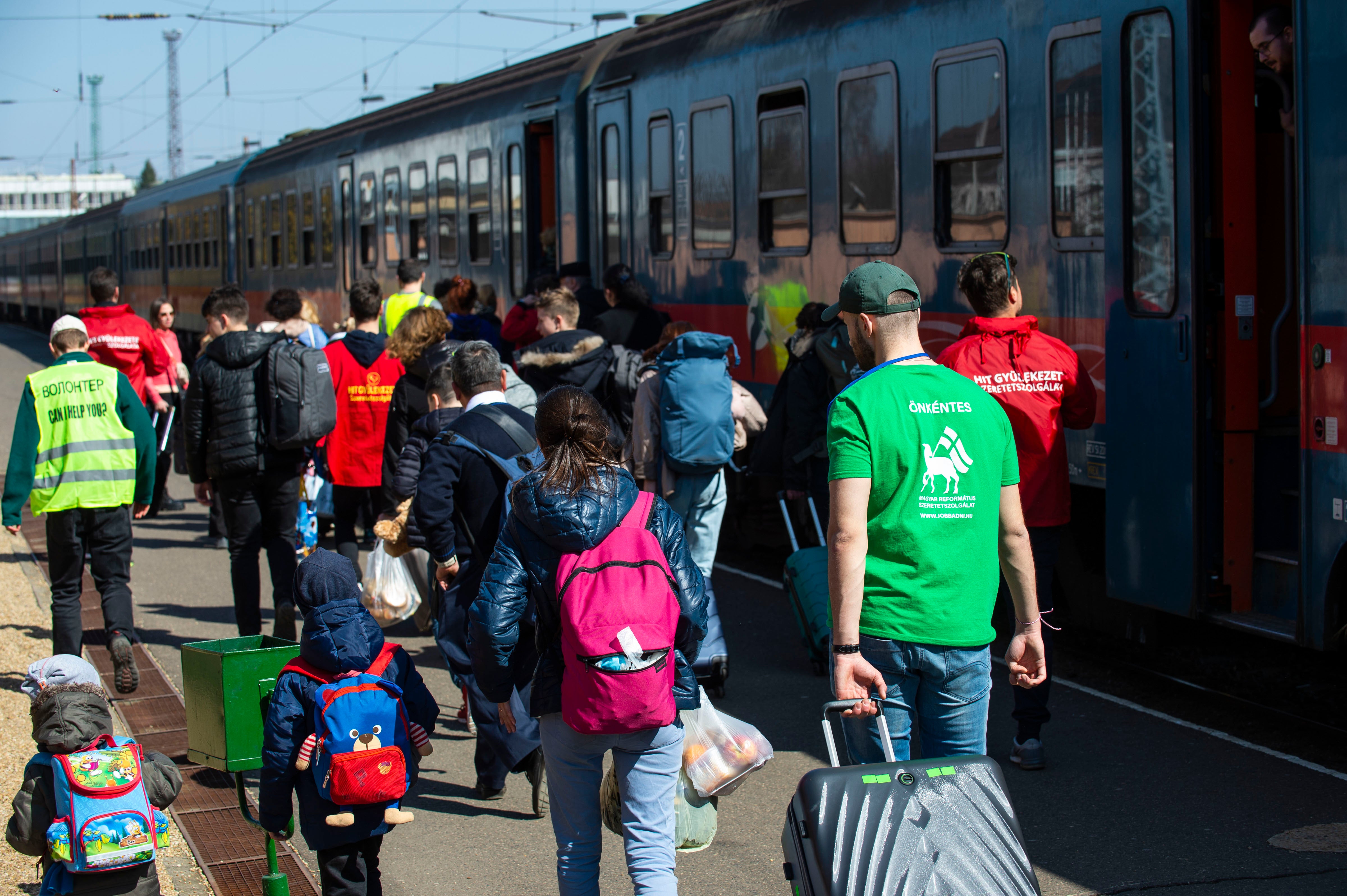 Aid workers from around the world helped the refugees as they disembarked in Hungary