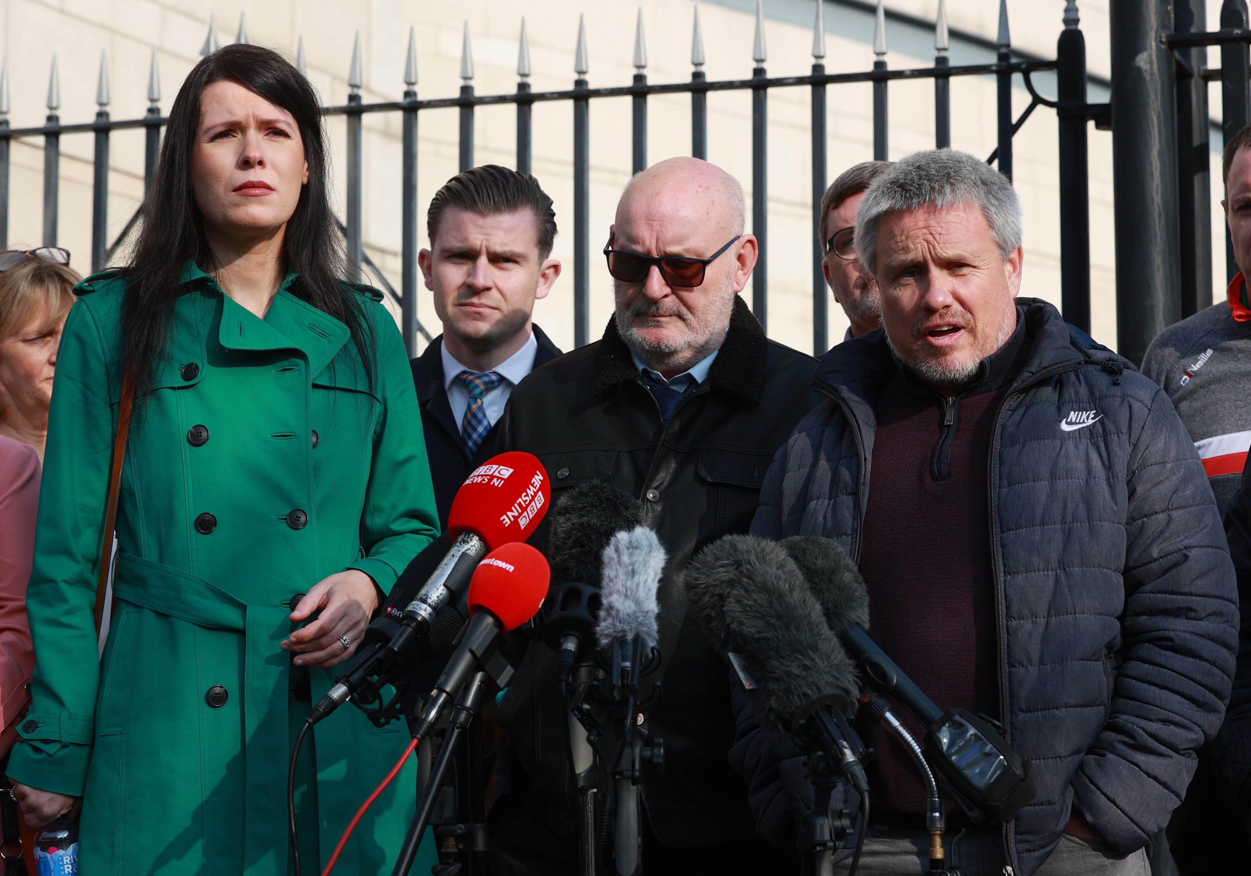 Grainne Teggart from Amnesty International (left), Sean McAnespie (centre) and Aidan McAnespie’s cousin Brian Gormley (right) outside Laganside Courts in Belfast (Liam McBurney/PA)