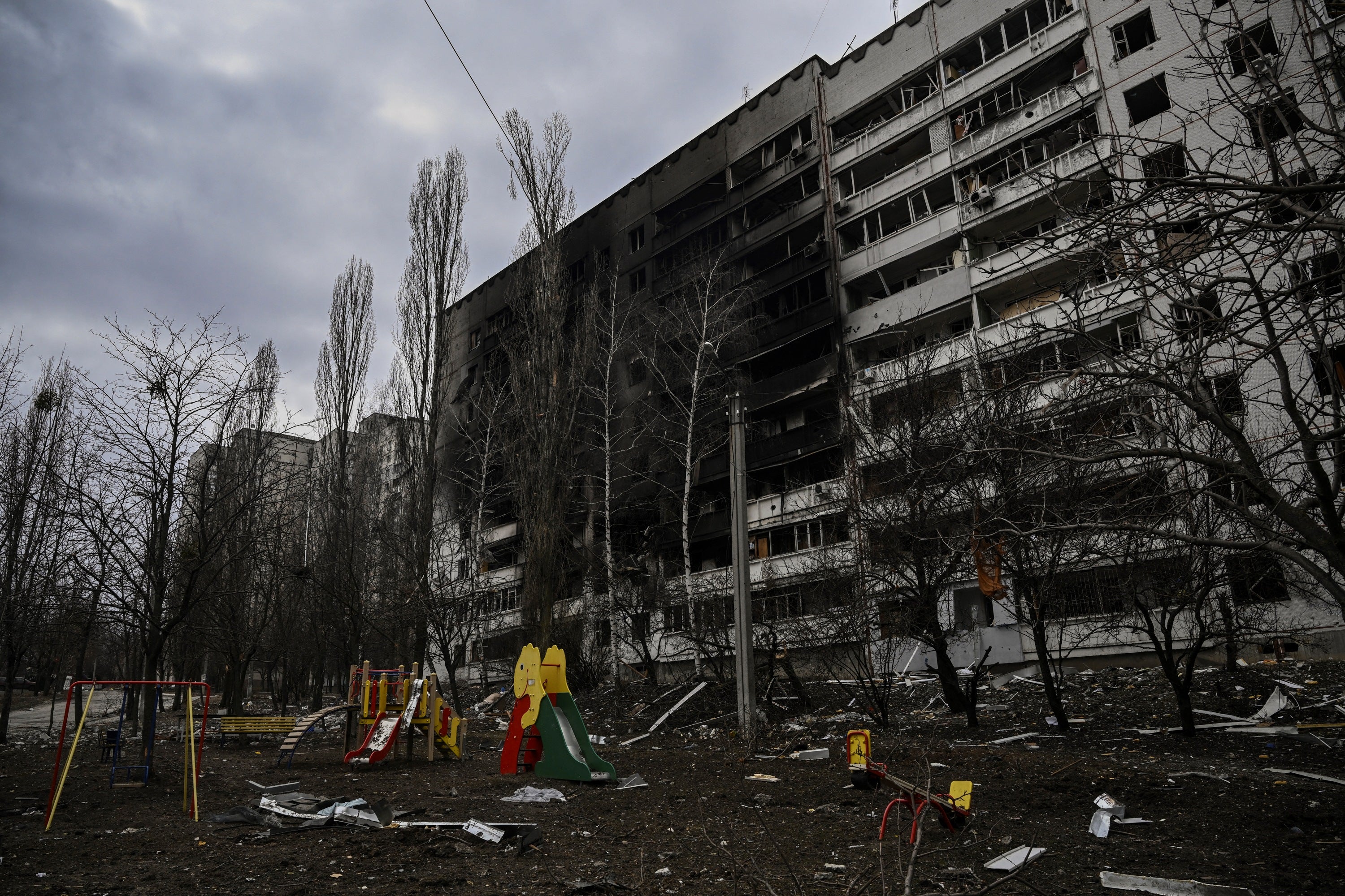 A heavily damaged apartment building is seen at a front line discrict of Kharkiv, 27 March 2022