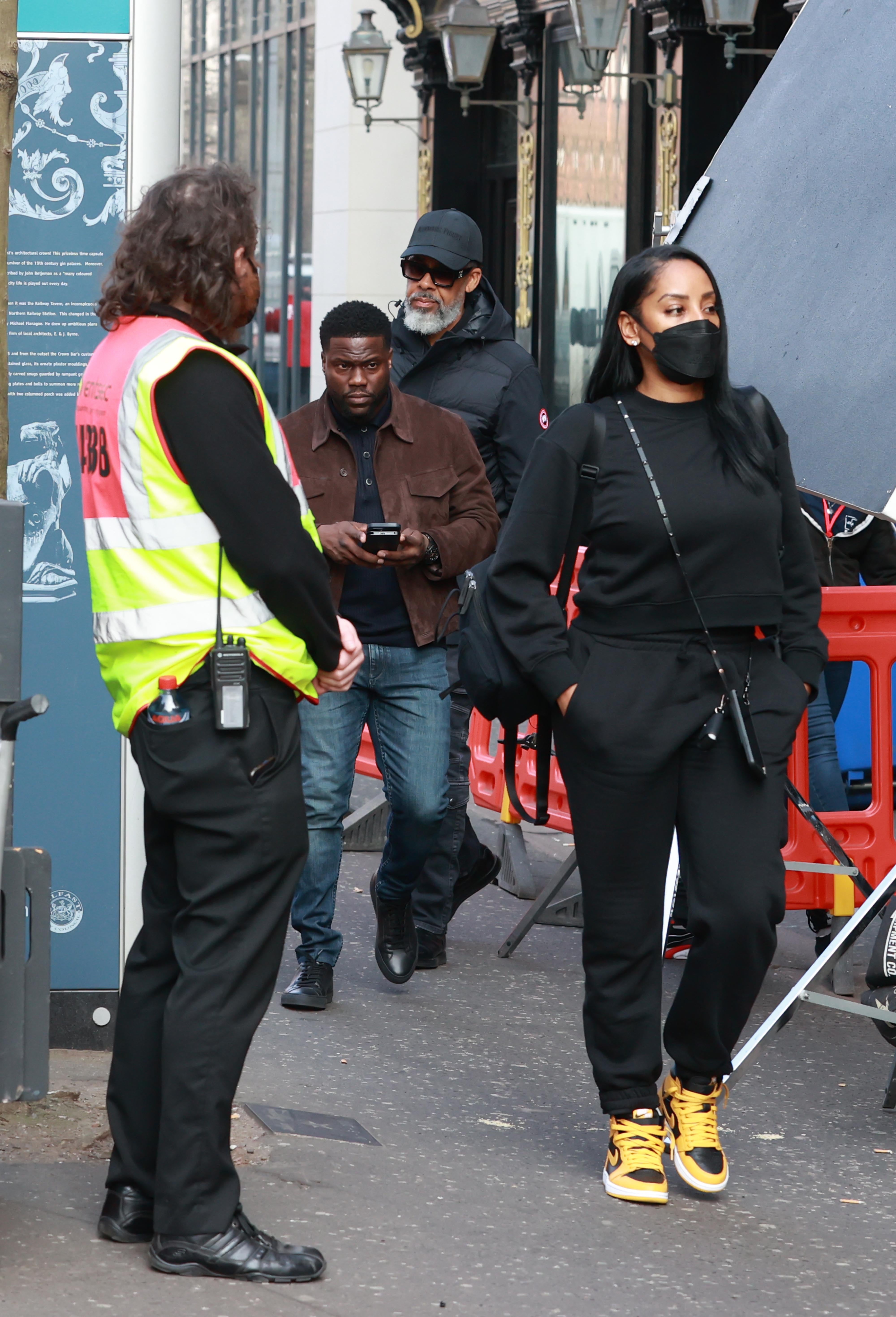 Kevin Hart (centre) on set during the filming of heist comedy Lift at the Crown Bar in Belfast (Liam McBurney/PA)
