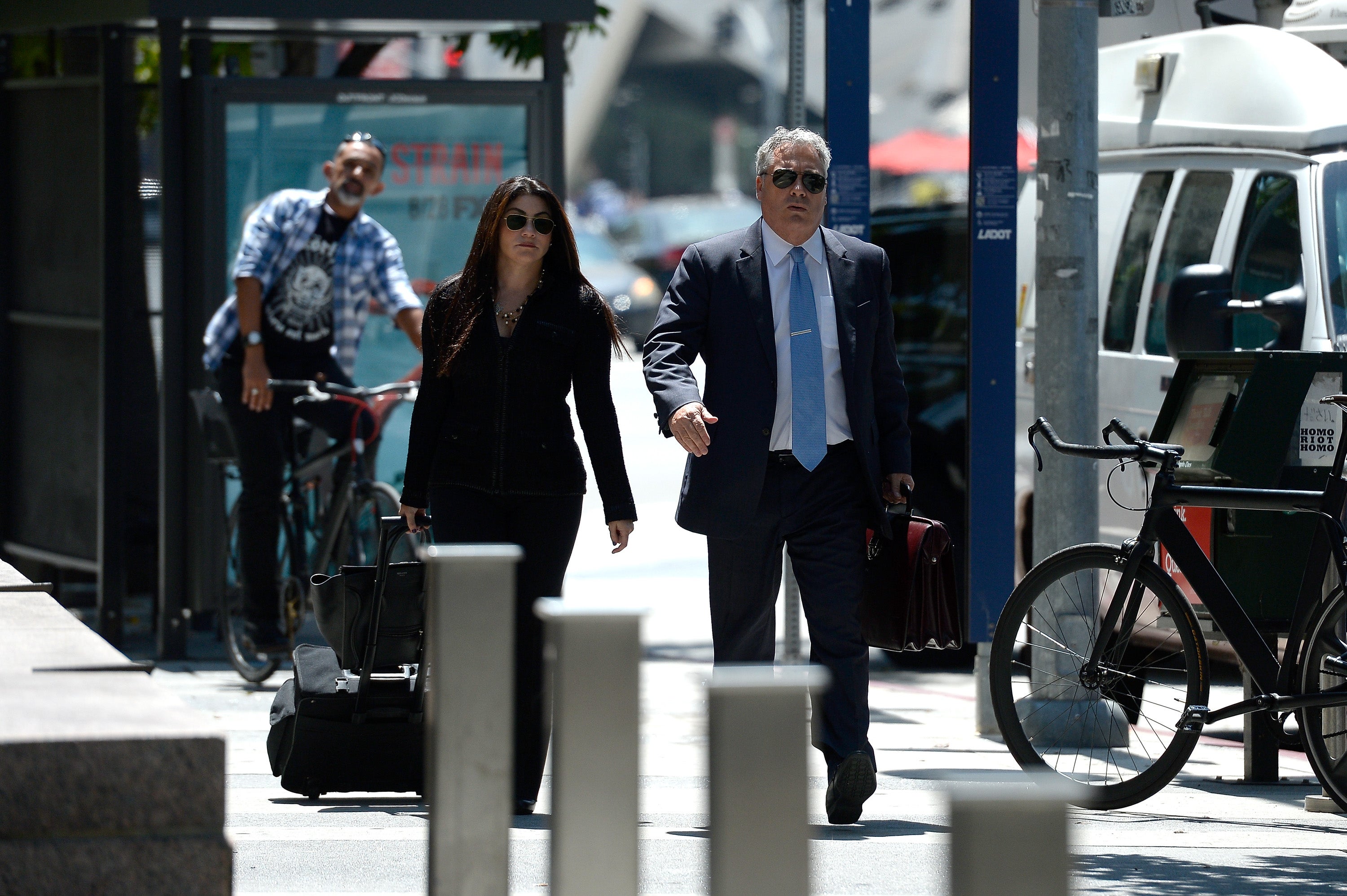 Amber Heard’s lawyer Samantha Spector (left) arrives for a court appearance on 9 August 2016 in Los Angeles