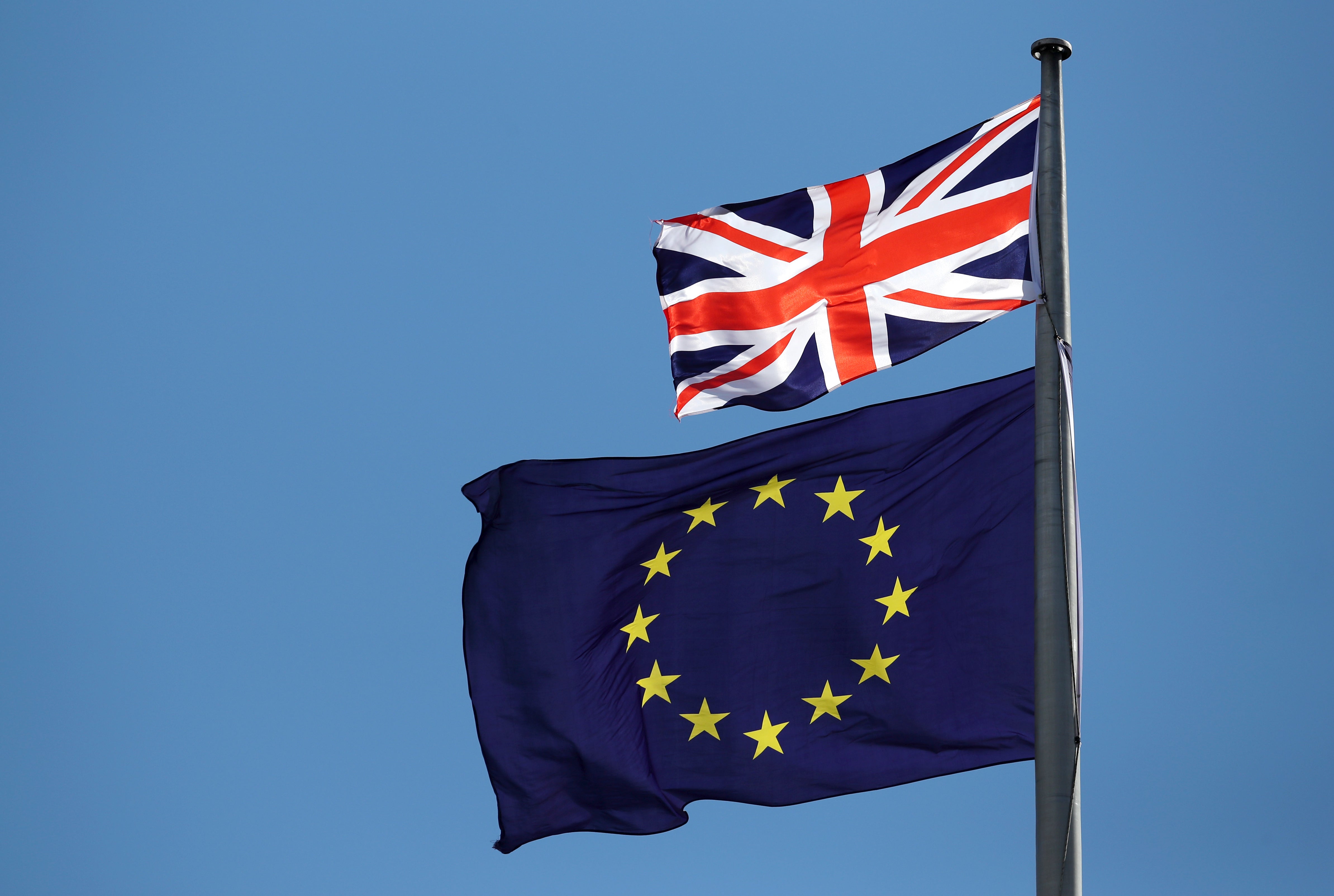 The UK flag and the EU flag (Jane Barlow/PA)