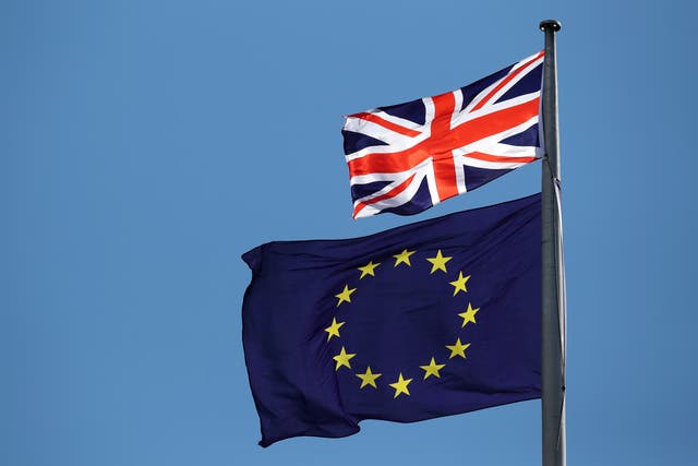 The UK flag and the EU flag (Jane Barlow/PA)
