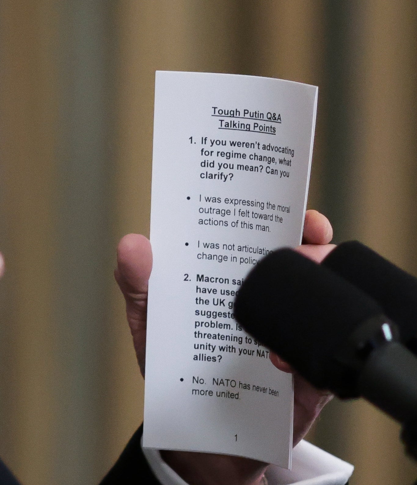 The printed paper held by Biden shows talking points related to his comments on Vladimir Putin and Nato