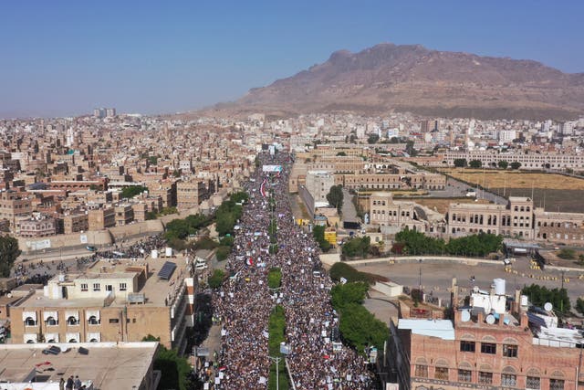 <p>Houthi supporters attend a rally marking the seventh anniversary of the Saudi-led coalition's intervention in Yemen's war in Sanaa, Yemen, Saturday</p>