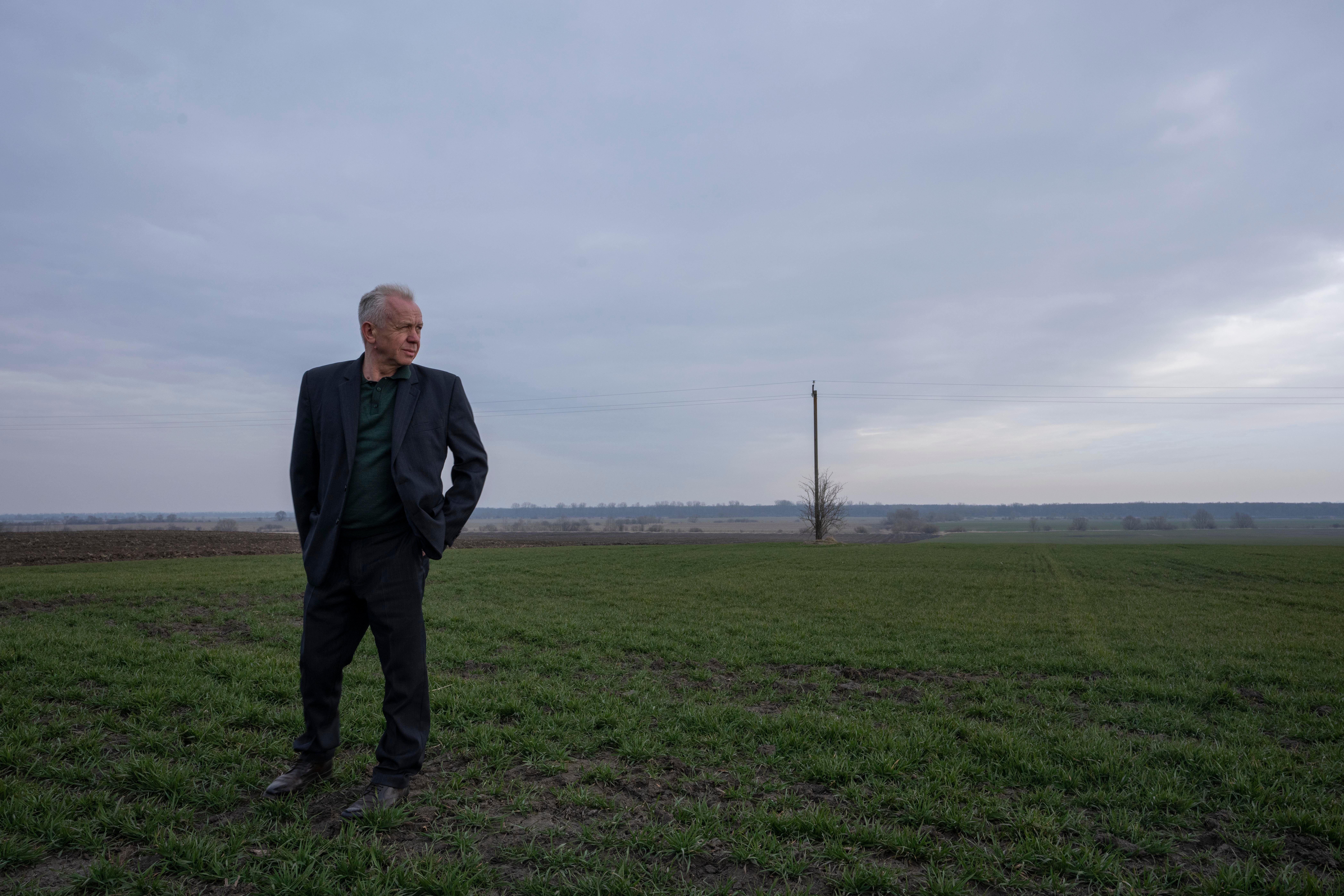 Ivan Kilgan, head of the regional agricultural association village, shows his fields of wheat, in Luky village, western Ukraine