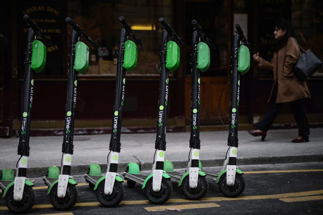 <p>Electric scooters parked in a Paris street. </p>