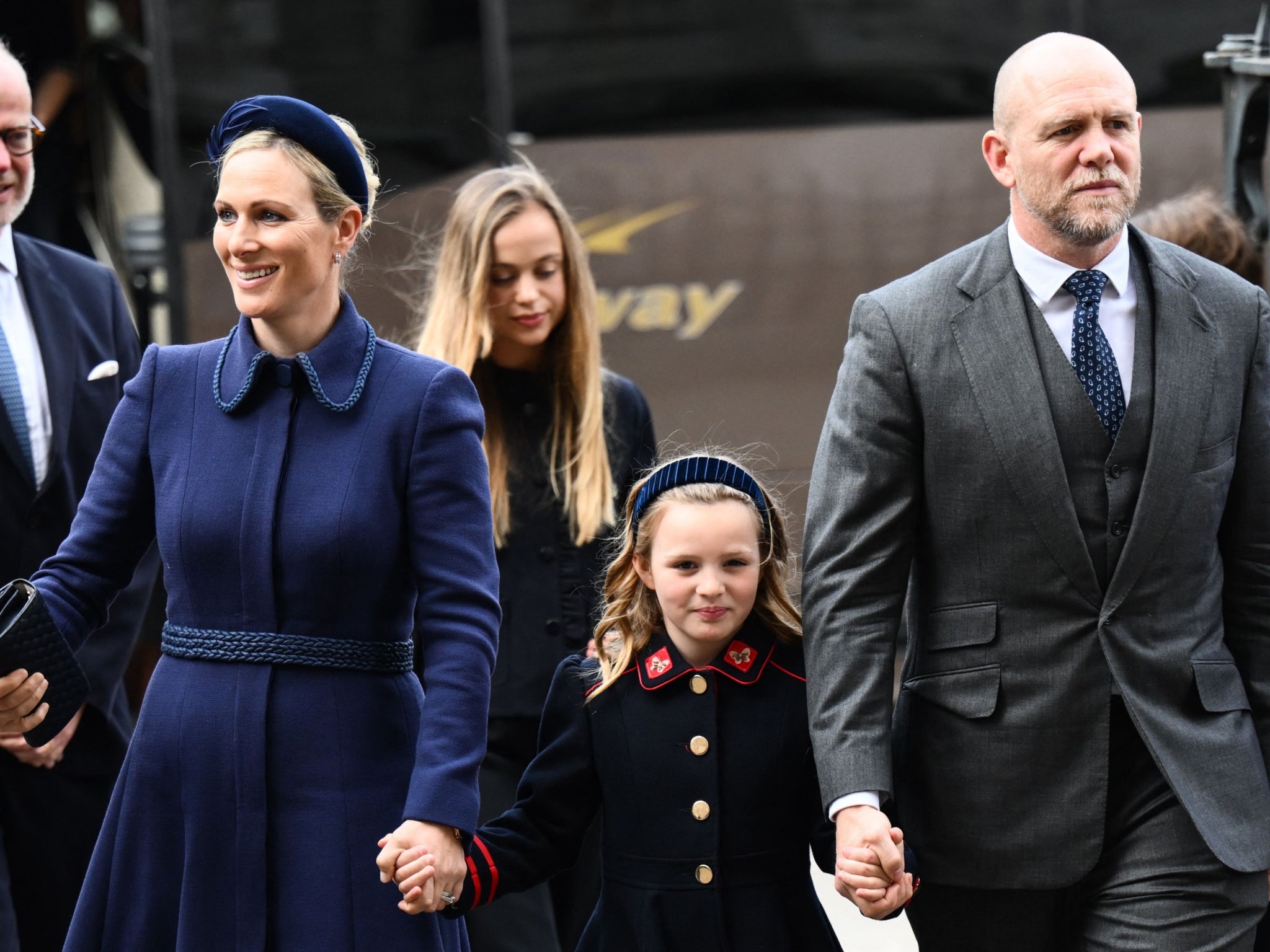 Zara Tindall (left) with her daughter, Mia, and husband, Mike