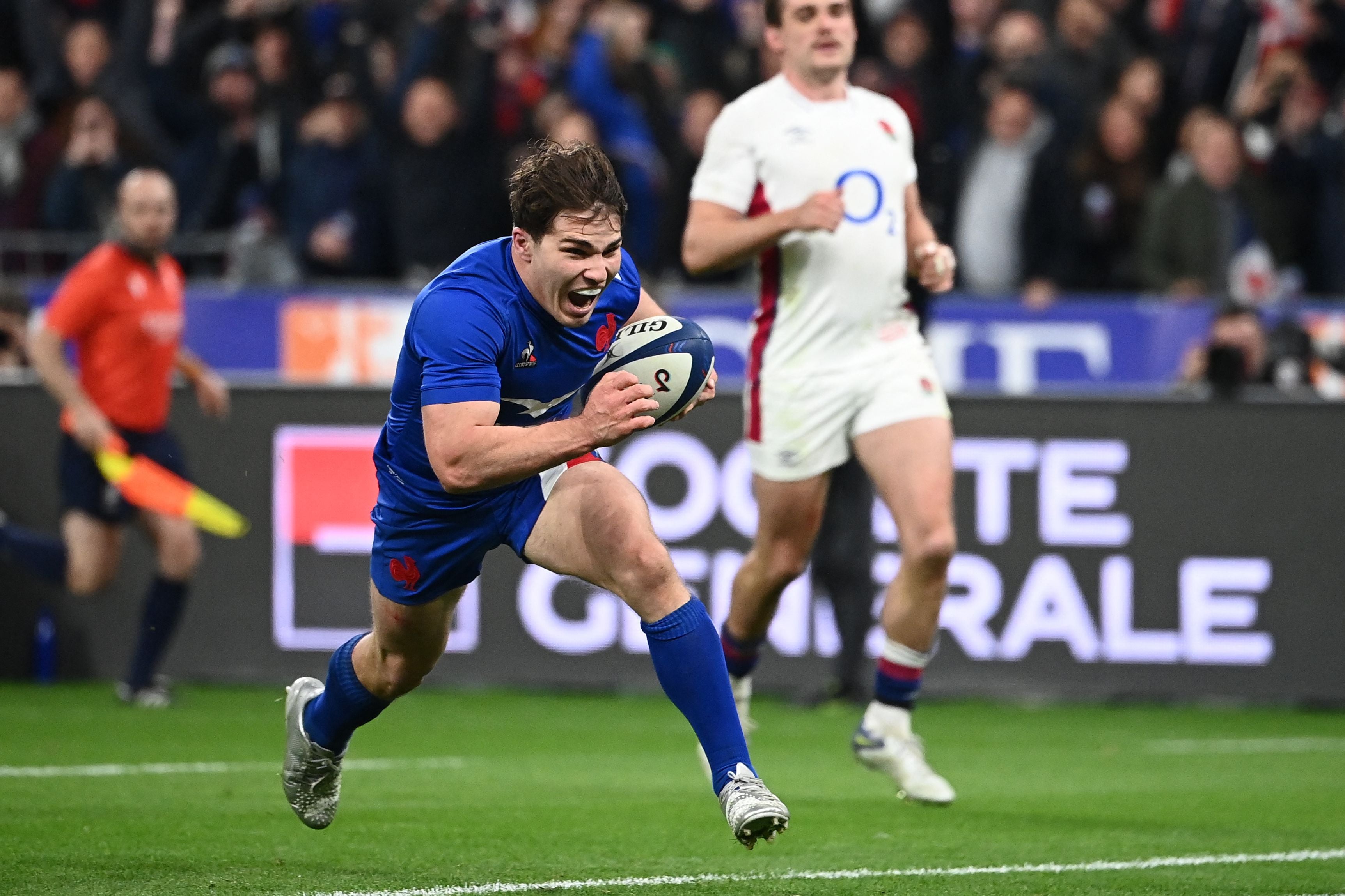 France’s scrum half Antoine Dupont scores a try