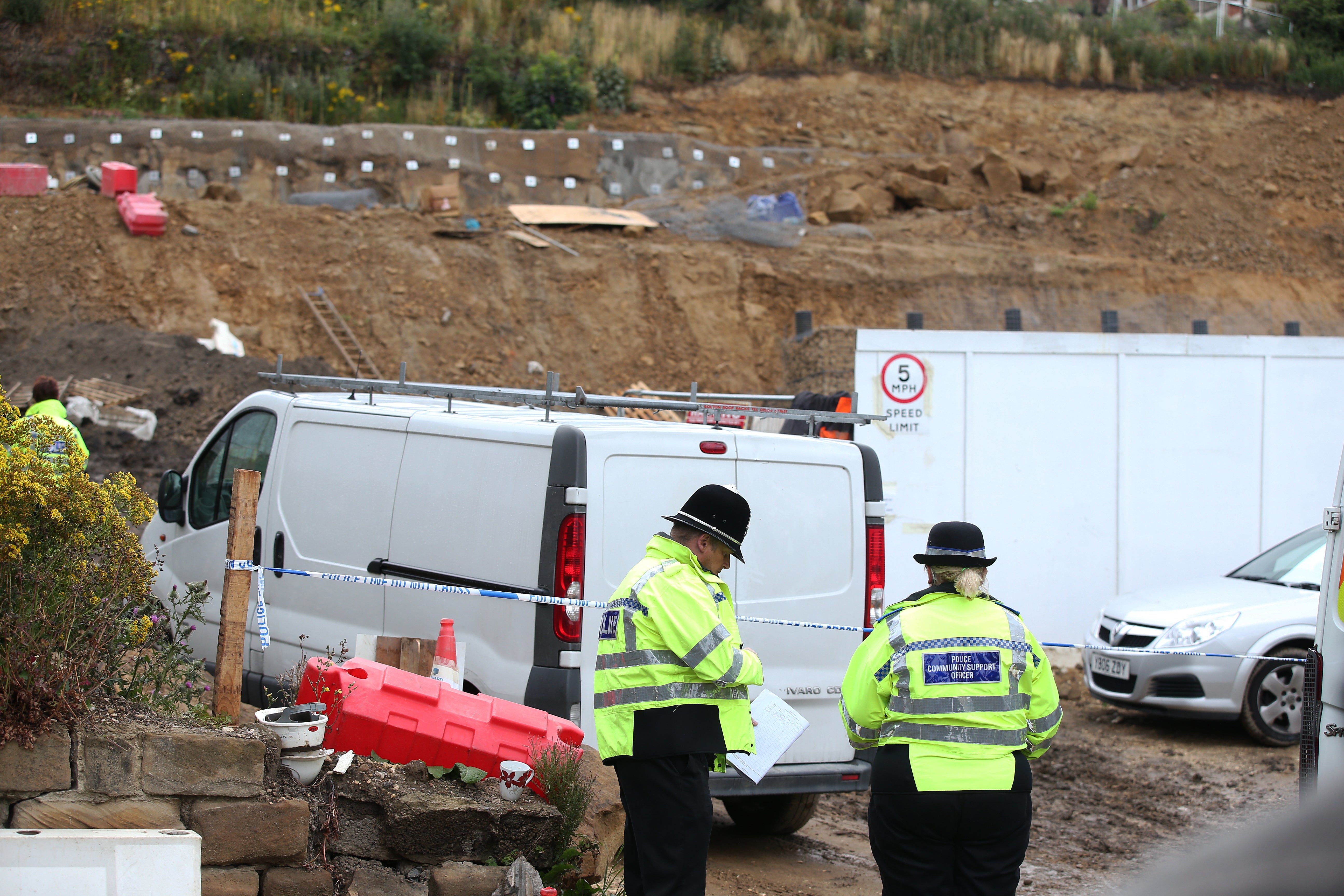 Police officers at the building site in Worsbrough