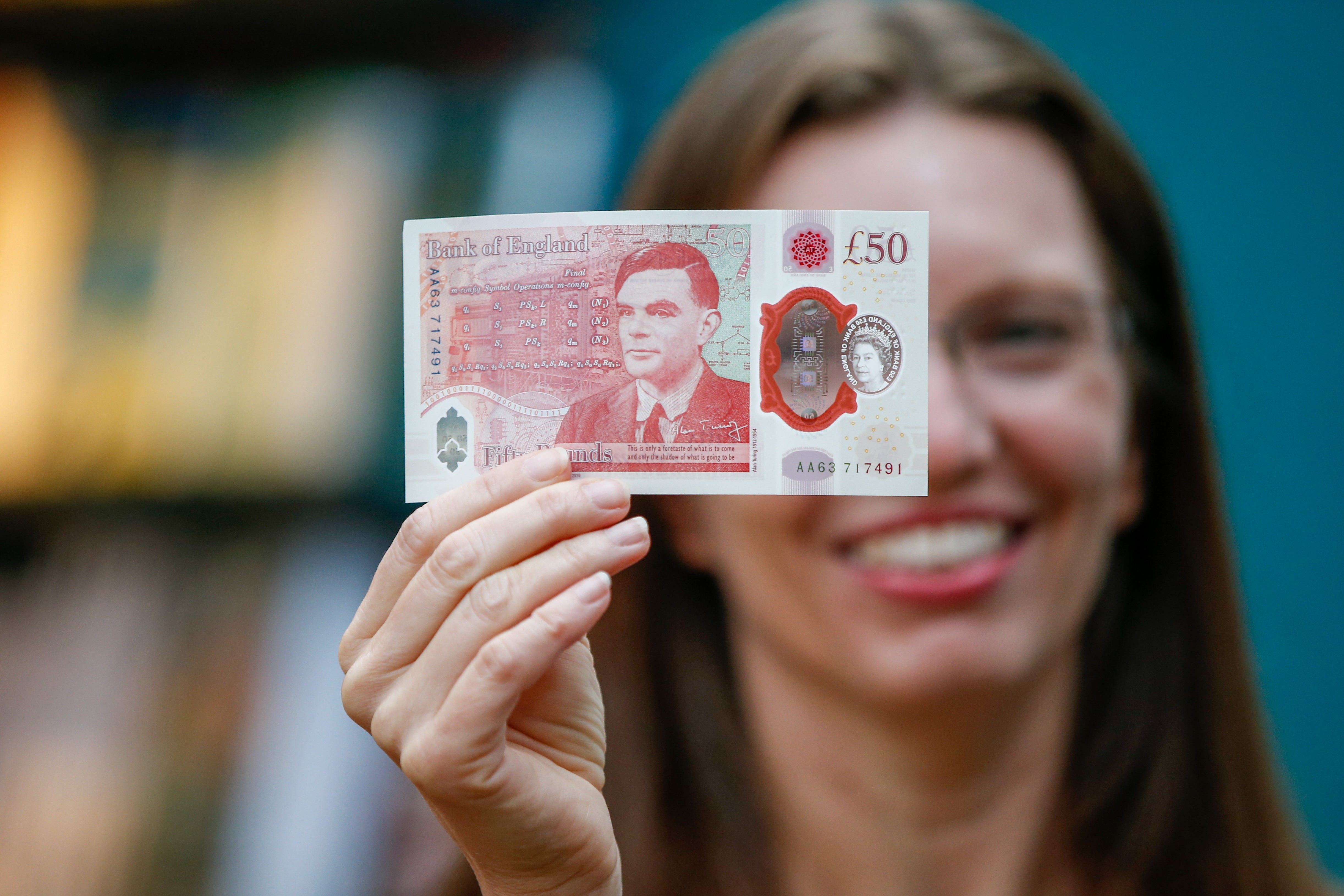 <p>Sarah John, chief cashier of the Bank of England, with a new £50 banknote </p>
