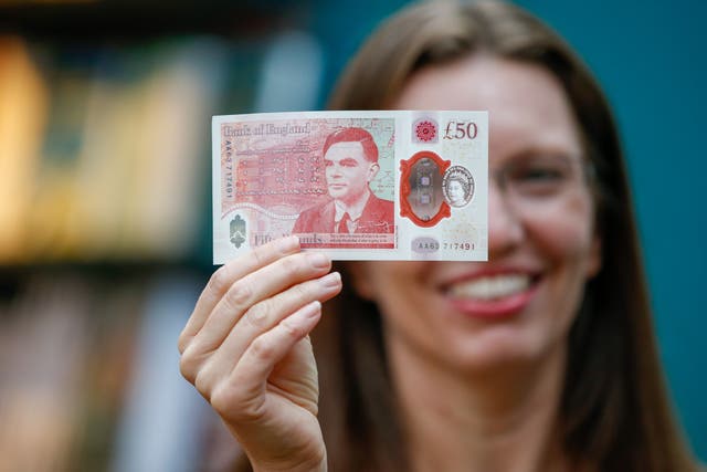Sarah John, chief cashier of the Bank of England, with a new £50 banknote featuring Alan Turing in 2021. People and businesses have just six months left before paper £20 and £50 banknotes lose their legal tender status (Hollie Adams/PA)