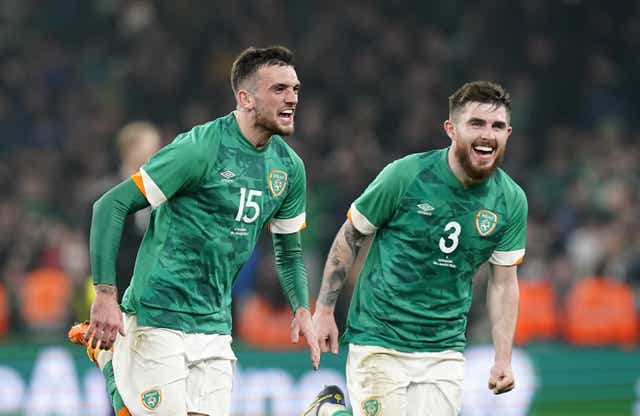 Republic of Ireland striker Troy Parrott (left) celebrates his winner against Lithuania with team-mate Ryan Manning (Niall Carson/PA)