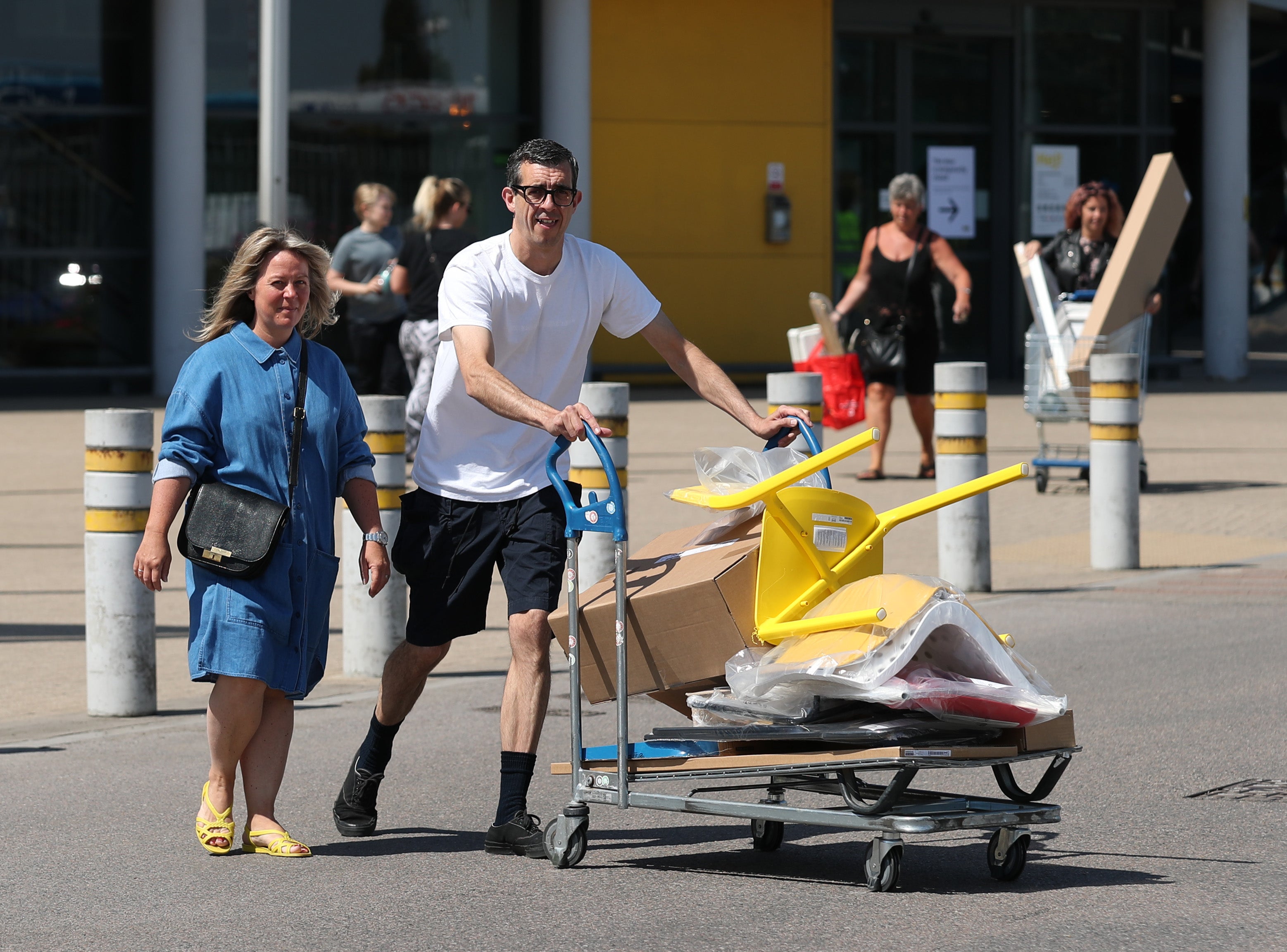 Customers carrying away their shopping at the IKEA Tottenham store (Yui Mok/PA)