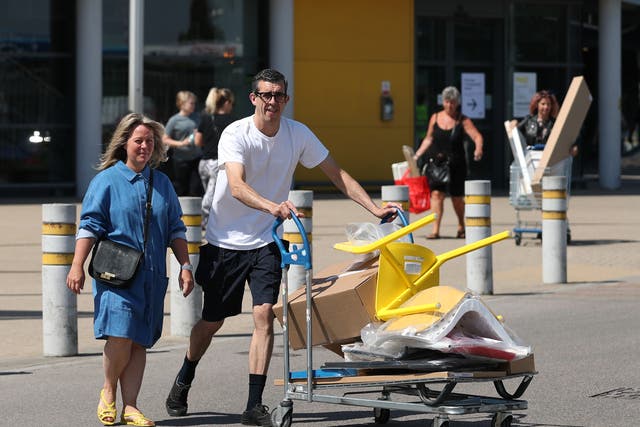 Customers carrying away their shopping at the IKEA Tottenham store (Yui Mok/PA)