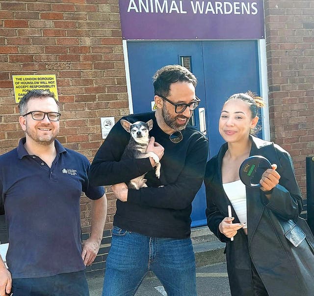 (from left to right) Andy Newnham with Dana Bennet and Tae Bennet when they were reunited with their dog (Hounslow Council/PA)