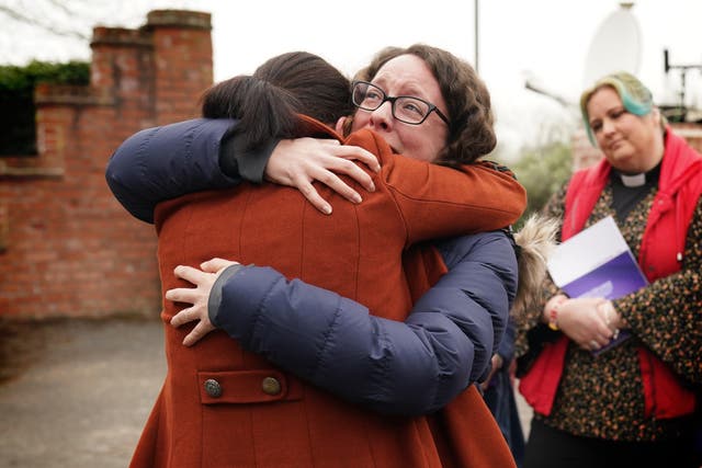 Rhiannon Davies (left) embraces Kayleigh Griffiths following the release of the final report by Donna Ockenden, chair of the Independent Review into Maternity Services at the Shrewsbury and Telford Hospital NHS Trust (PA)