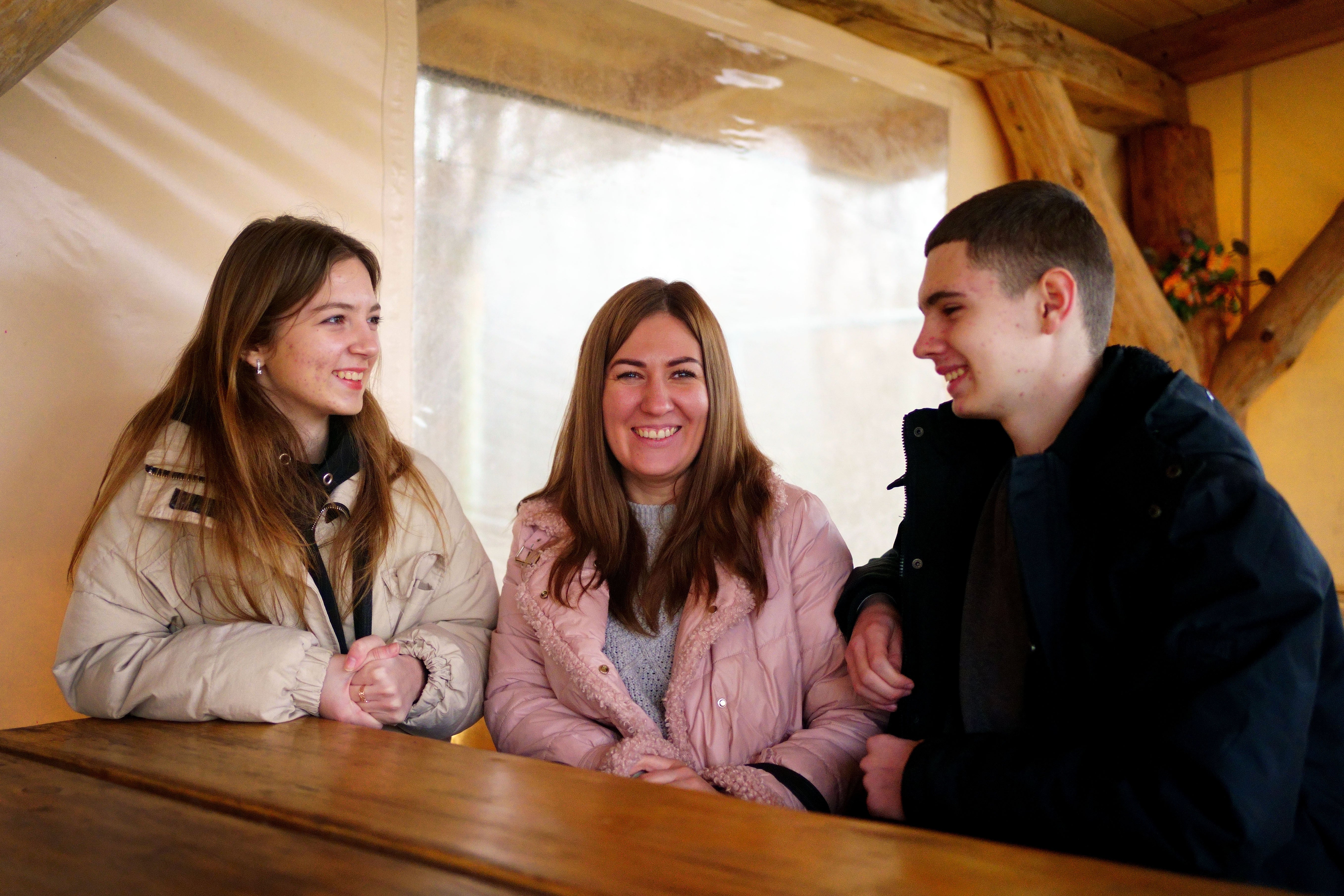 A family of Ukrainian refugees in Poland waiting for news of their visa application to come to the UK (Victoria Jones/PA)