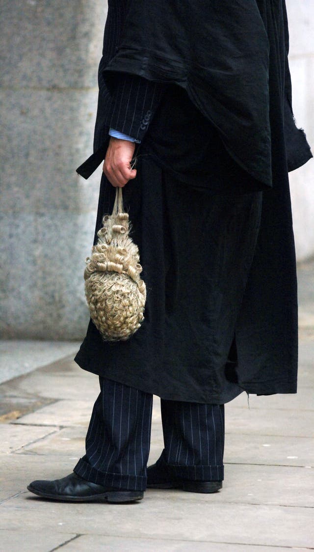 Detail view of a barrister holding a legal wig (Clara Molden/PA)