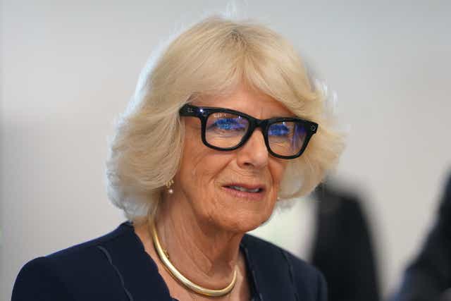 The Duchess of Cornwall tries on a pair of video and picture enable Ray-Ban glasses (Kirsty O’Connor/PA)