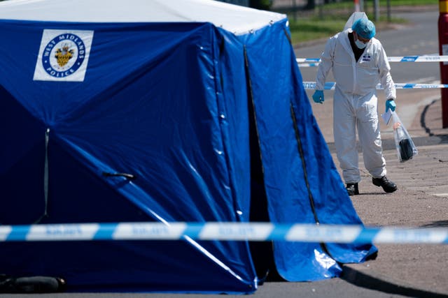 A forensics officer at the scene in Kingstanding (PA)