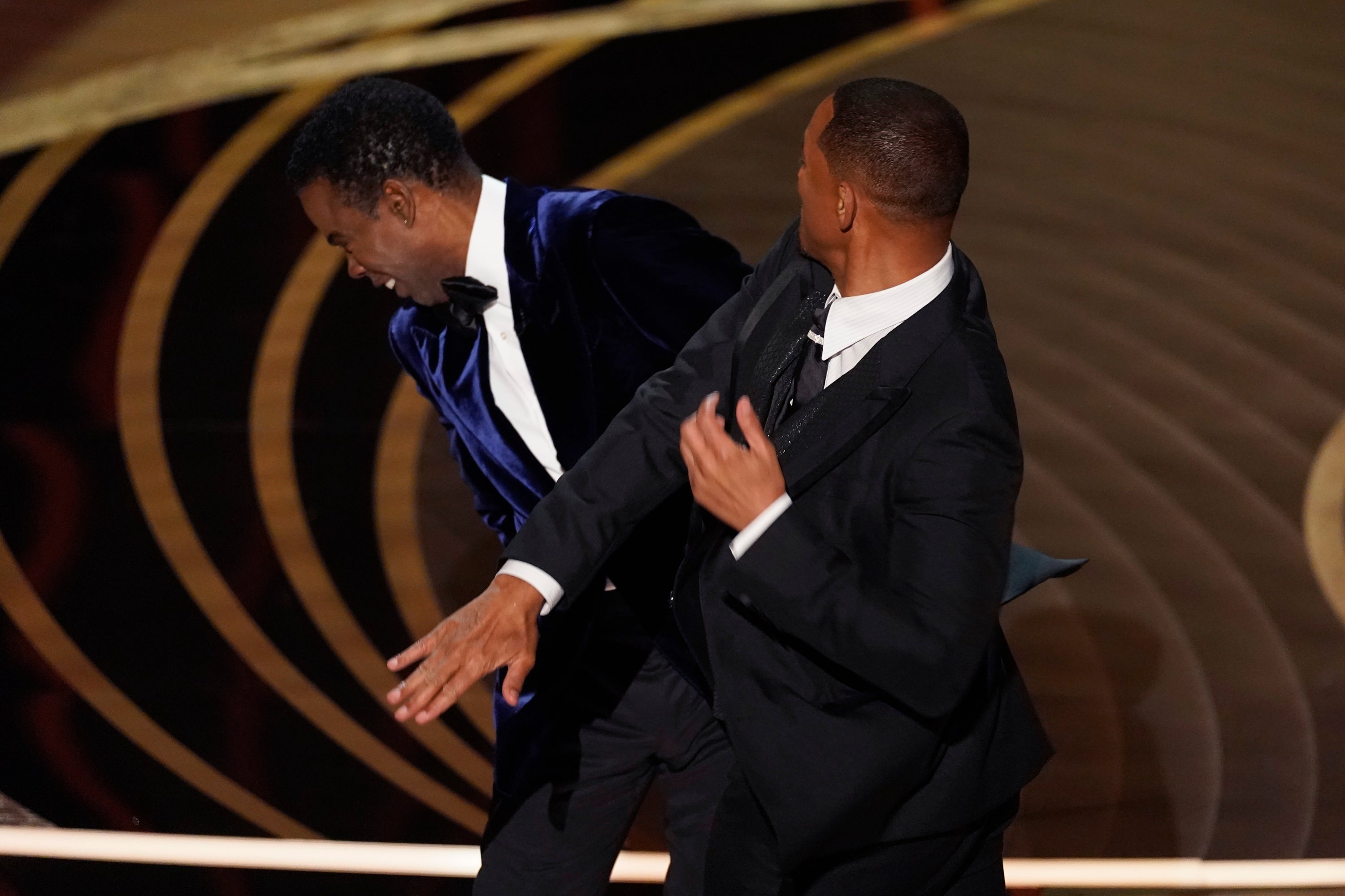 Will Smith hit Chris Rock onstage at the Oscars live ceremony, moments before accepting the Best Actor award