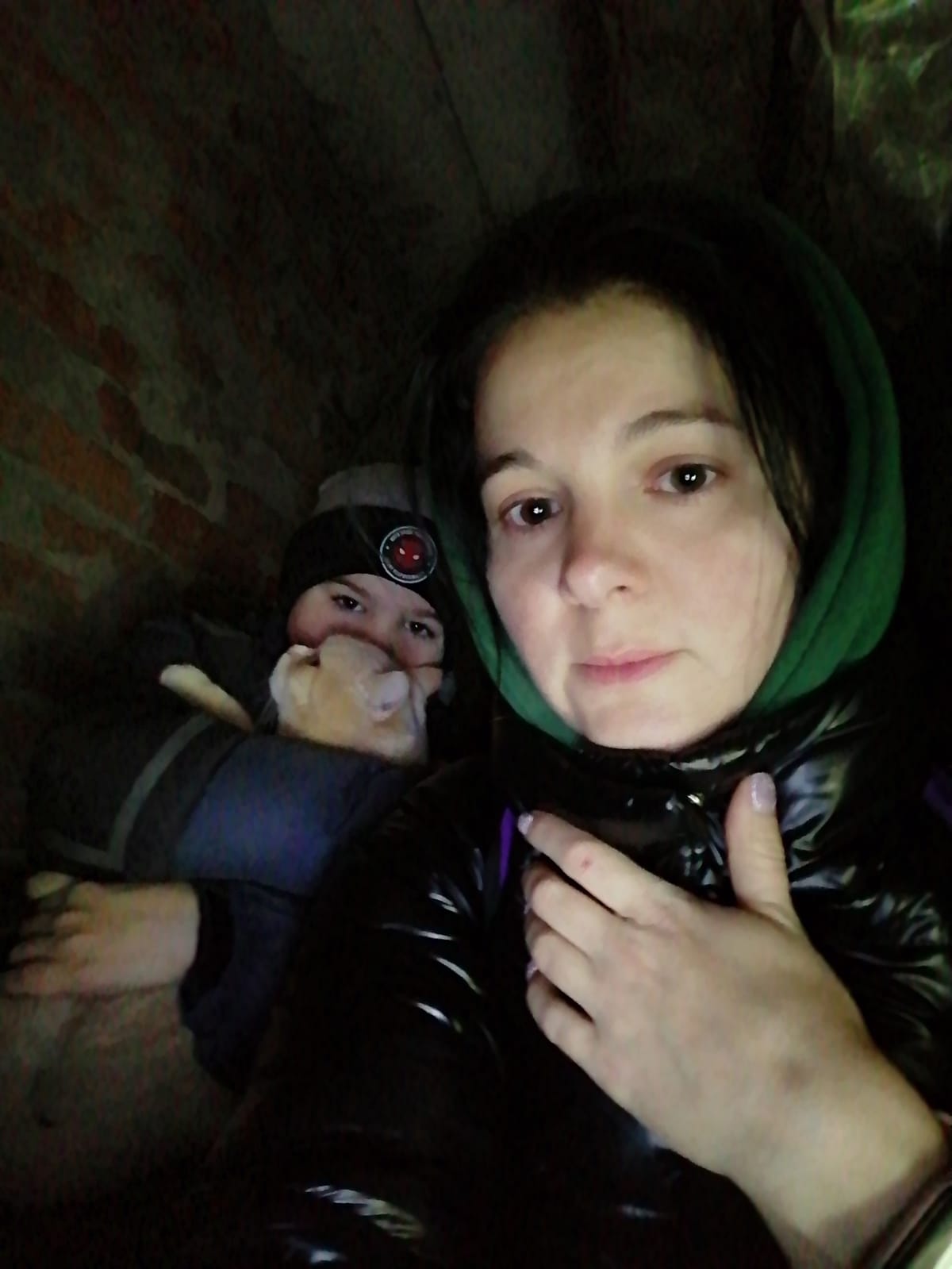 Yulia Zhdanova and her son inside their shelter in Chernihiv