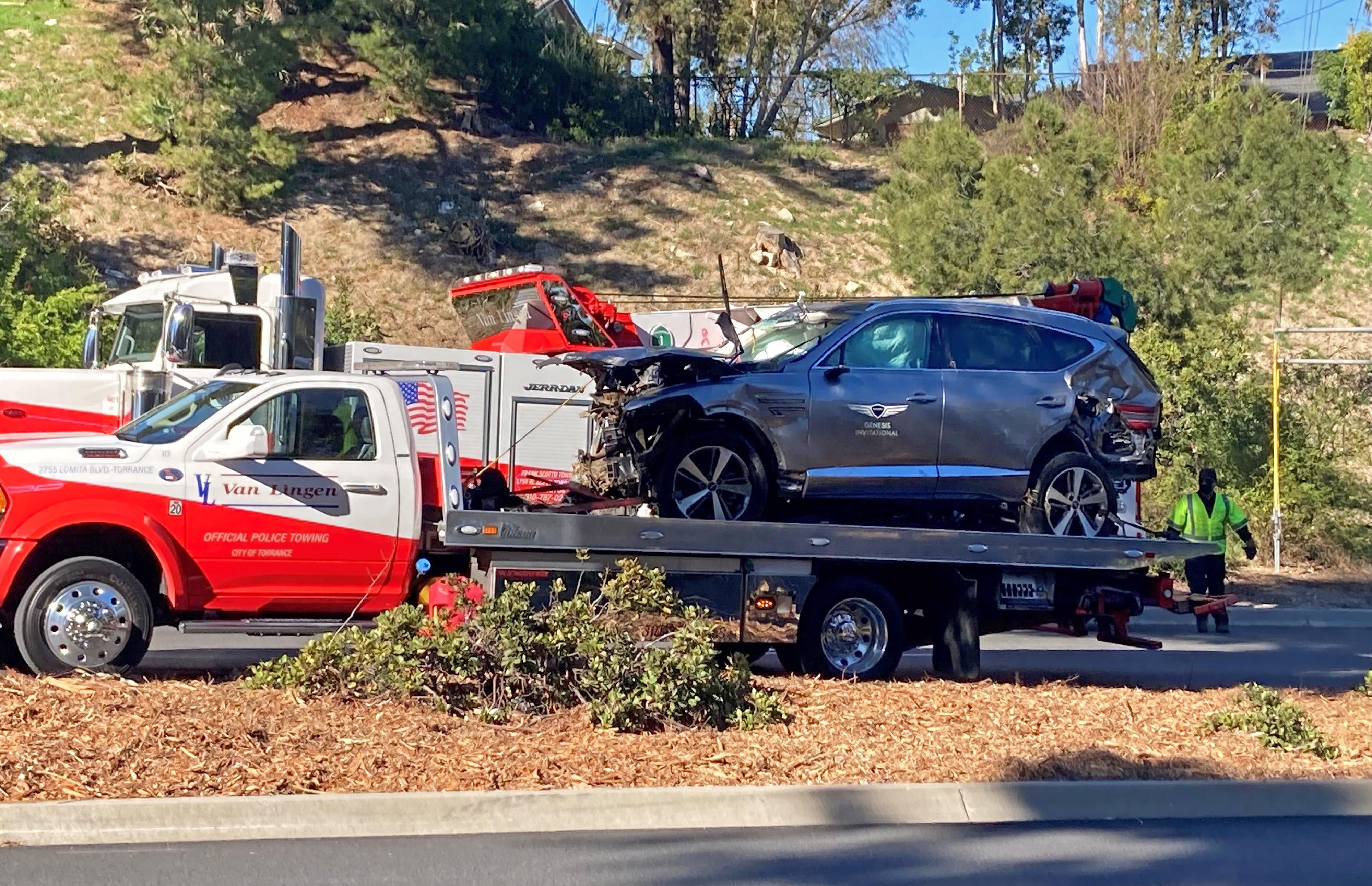 The vehicle driven by Tiger Woods on the back of a truck in Los Angeles after he suffered leg injuries when the vehicle rolled over (Keiran Southern/PA)