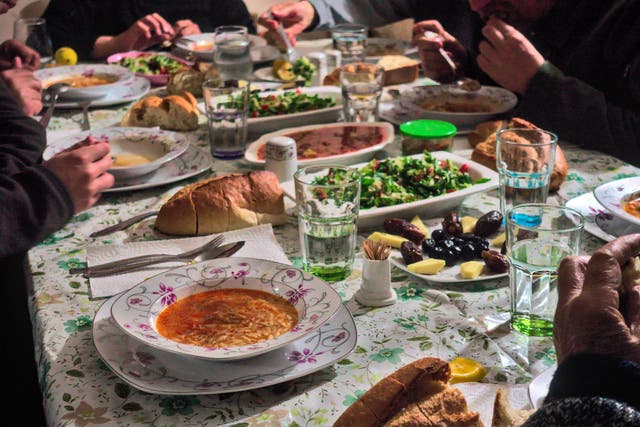 <p>A dining table full of food
</p>