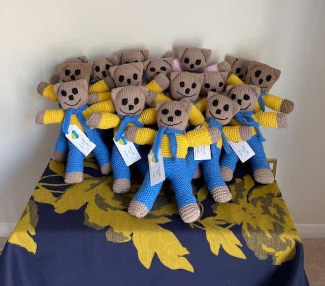 The teddies have been knitted in the colours of the Ukrainian flag (Mhairi Clarke/PA)