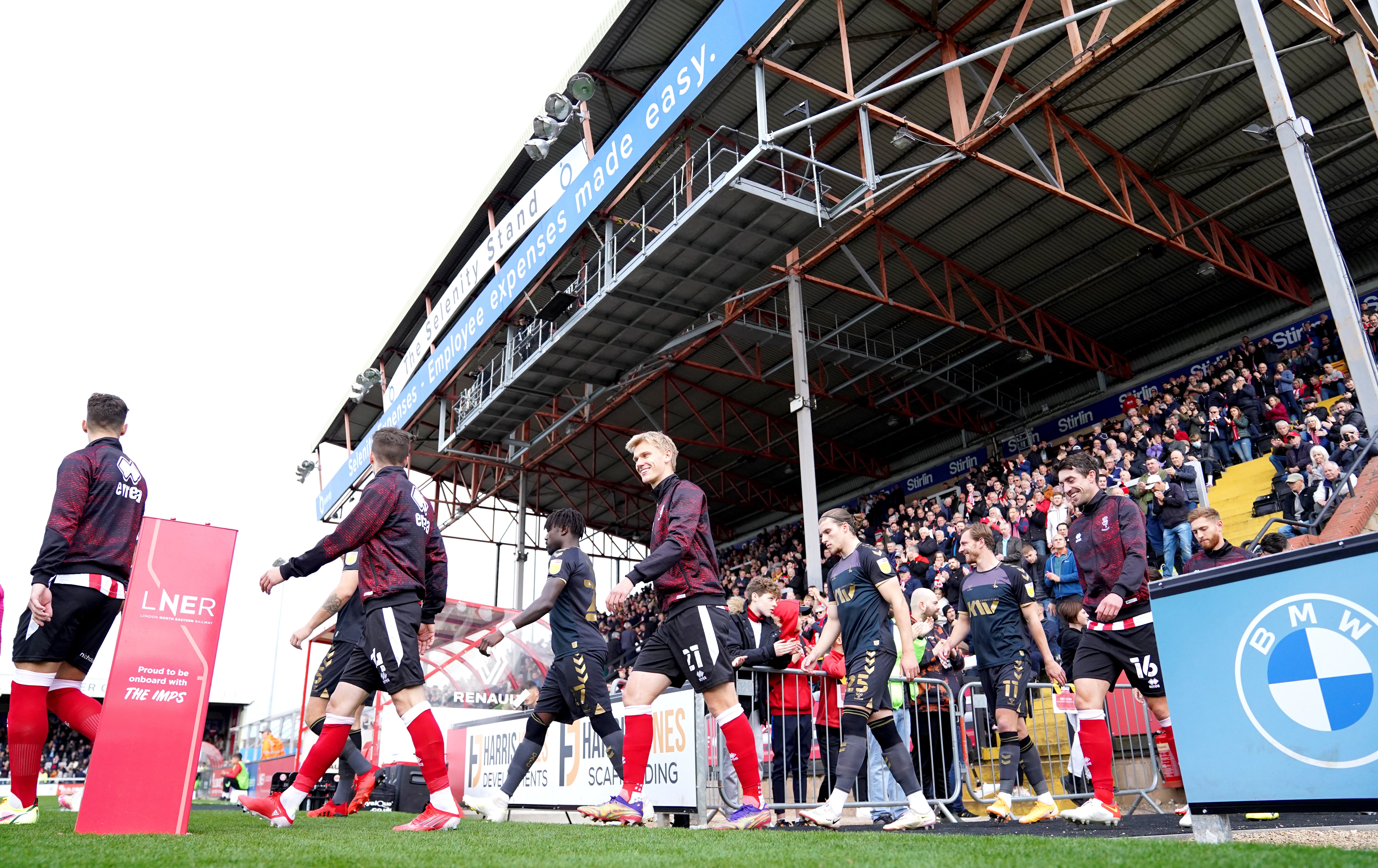 Players at Lincoln’s home ground (Tim Goode/PA)