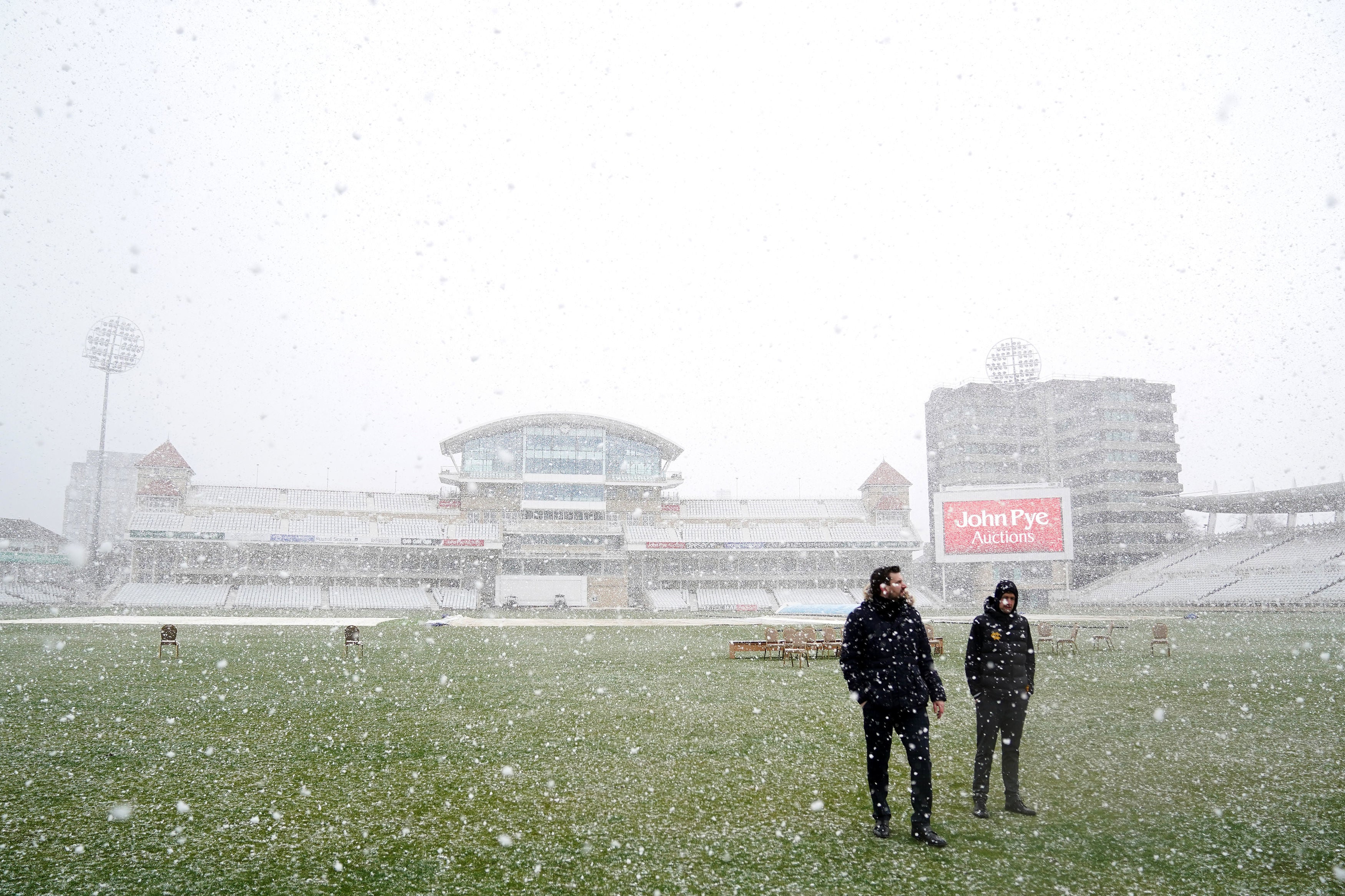 Snow falls during a photocall at Trent Bridge cricket ground in Nottingham