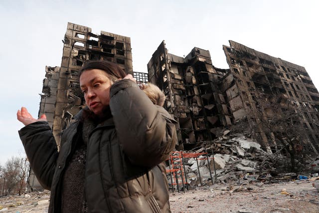 <p>Nurse Svetlana Savchenko, 56, stands next to a building where her apartment was located in the besieged southern port city of Mariupol</p>