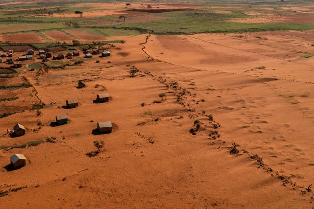 <p>Sand begins to surround houses close to the town of Ambovombe, Androy region, Madagascar</p>