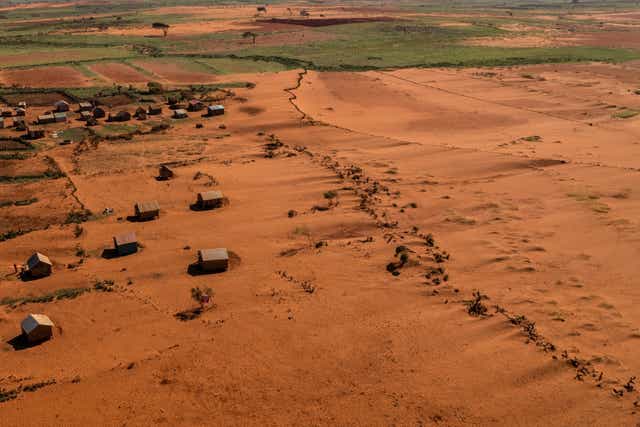 <p>Sand begins to surround houses close to the town of Ambovombe, Androy region, Madagascar</p>