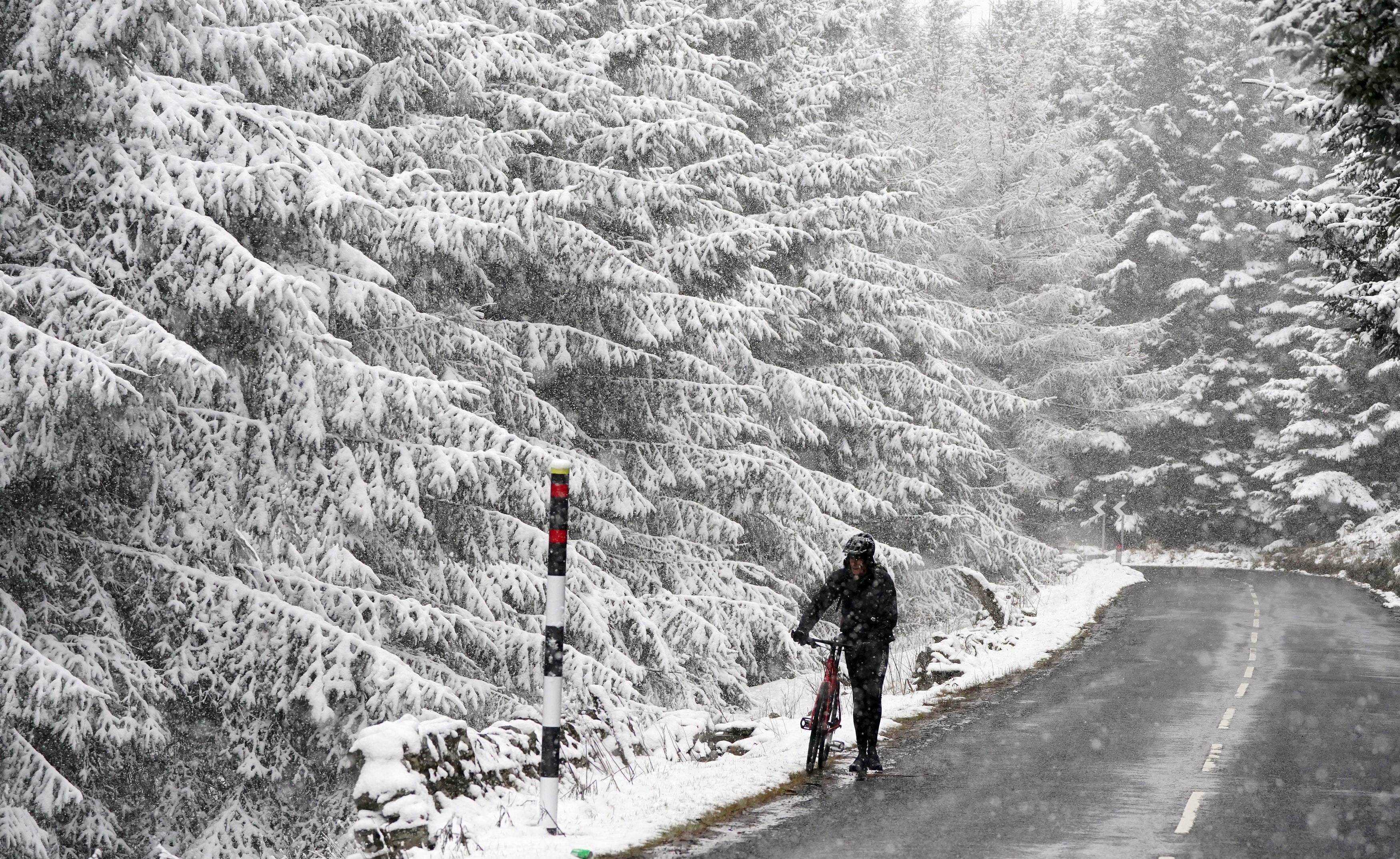 Terry Smith, 57, from Coventry who is undertaking the coast to coast route, which he started from Whitehaven in Cumbria, hits snow in Allenheads, in the Pennines to the north of Weardale in Northumberland