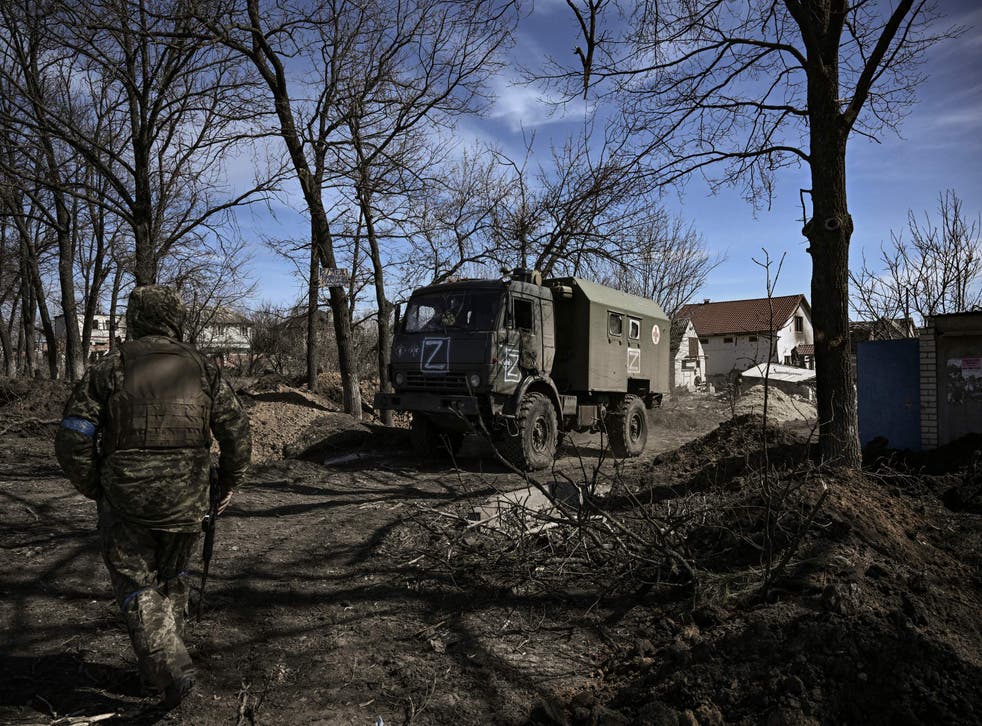 <p>Ukranian troops drive a captured Russian military vehicle after retaking the village of Mala Rohan, east of Kharkiv</p>
