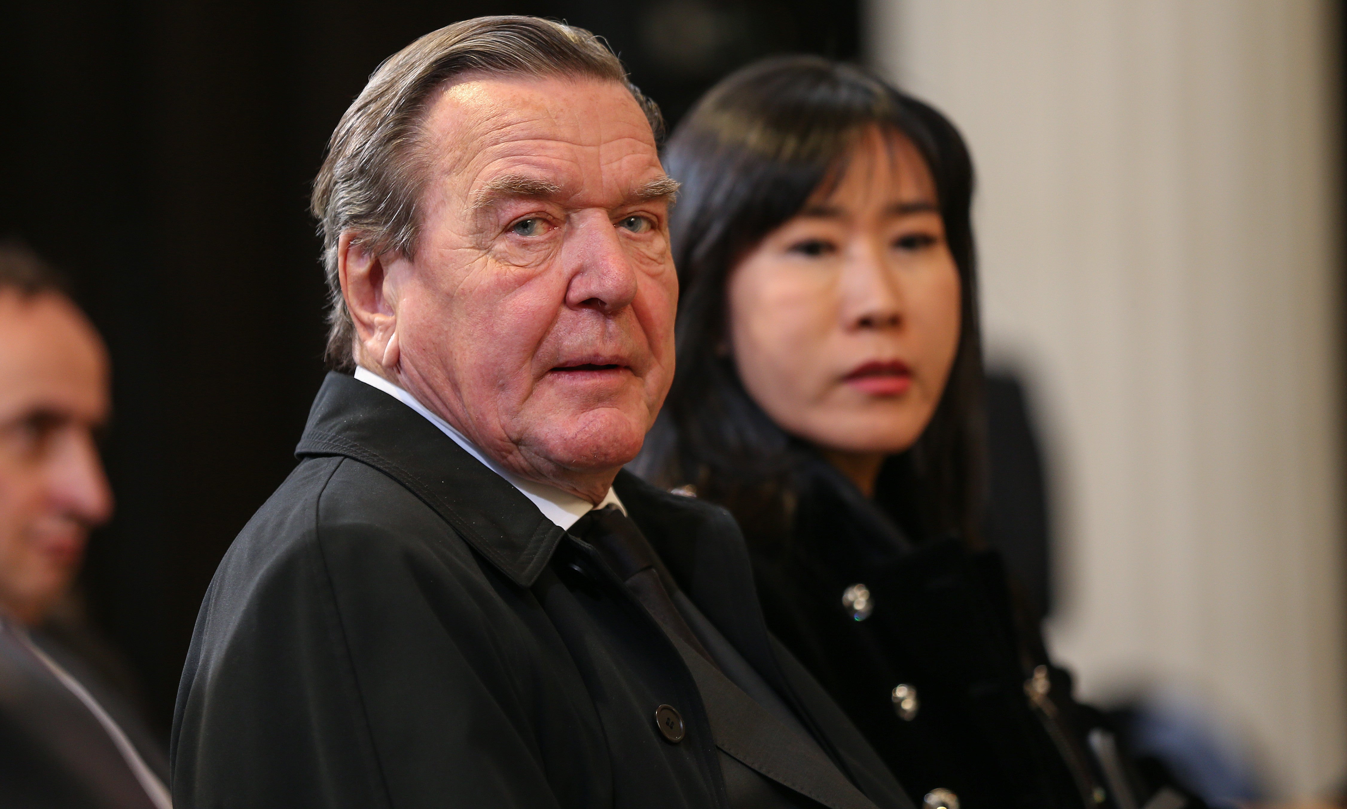 Schröder and his wife Soyeon Schröder-Kim attend a memorial service in Potsdam, Germany, 21 January 2020