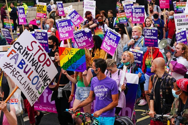 Demonstrators on Reclaim Pride march in London calling on Boris Johnson to ‘stop stalling’ on LGBTI rights (Victoria Jones/PA)