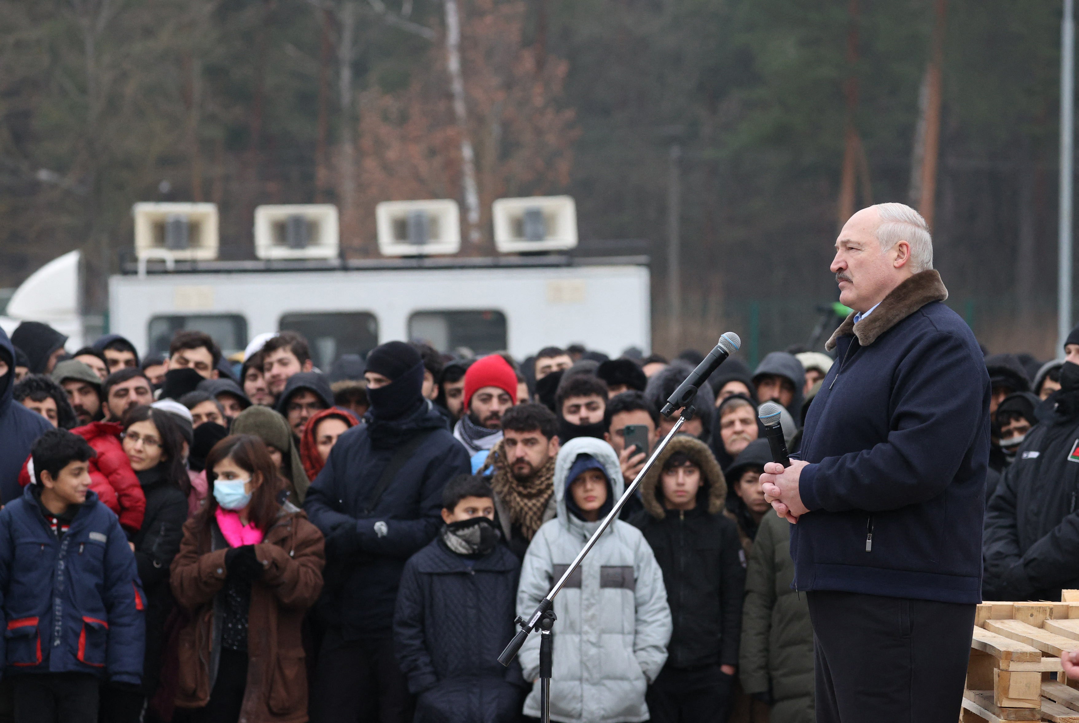 Mr Lukashenko visits a centre for migrants near the Bruzgi border point on the Belarusian-Polish border in the Grodno region, 26 November 2021