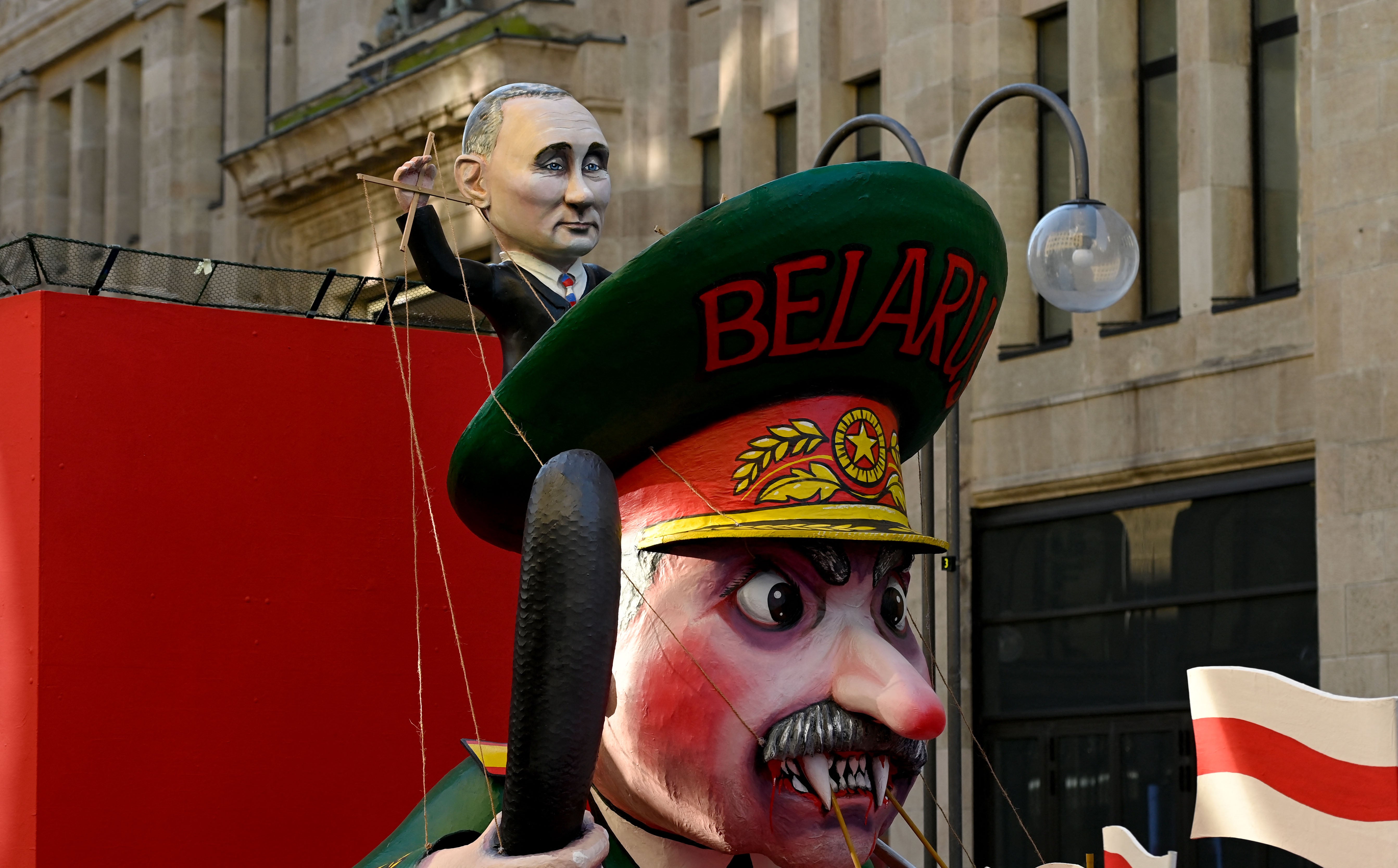 A carnival float featuring Mr Putin handling Mr Lukashenko like a puppet is seen at a peace march in Cologne, Germany, 28 February 2022