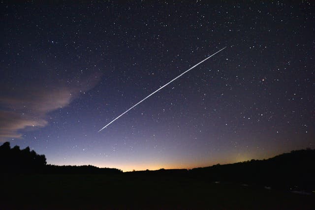 <p>File photo: Long-exposure image shows a trail of a group of SpaceX's Starlink satellites passing over Uruguay in 2021 </p>