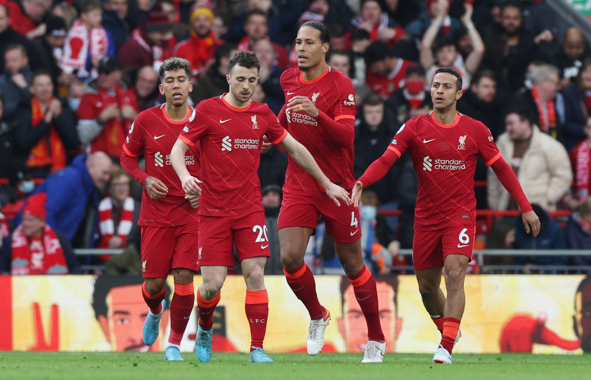 Jota celebrates his opener with teammates